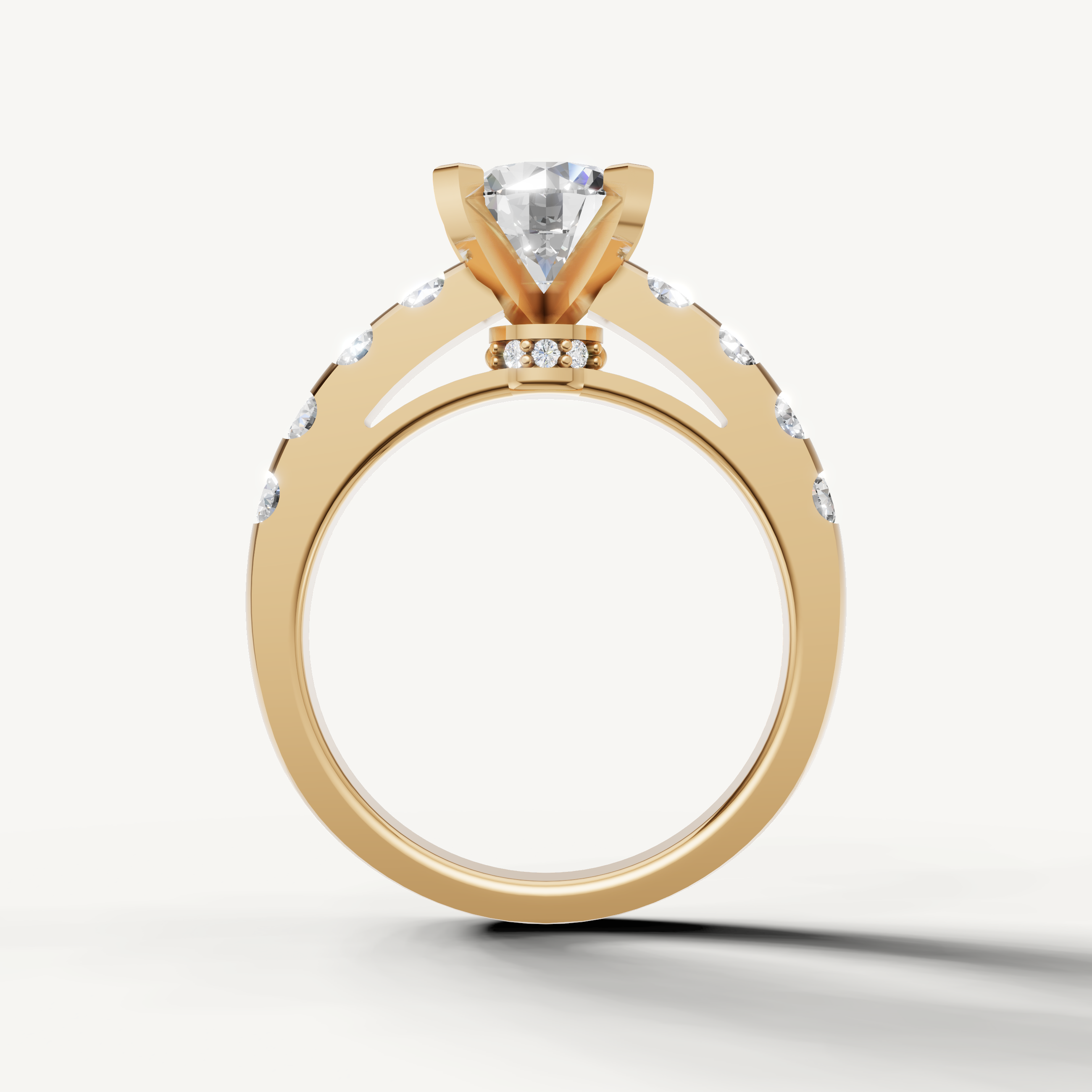 Close-up of Seo yellow gold round solitaire ring with pavé accents by Raul Diamonds.