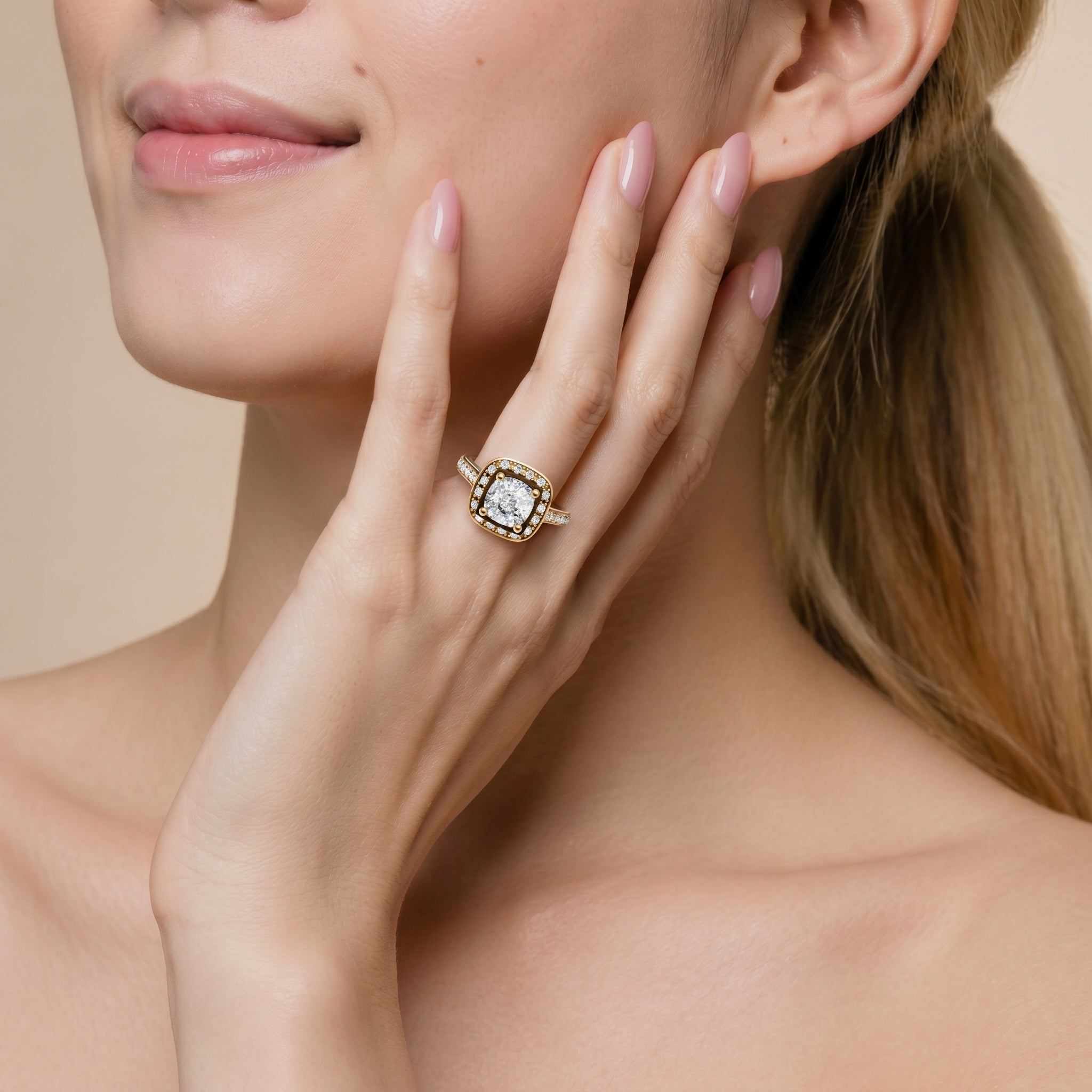 Model wearing the Seo round halo diamond engagement ring from Raul Diamonds in luxurious gold with sparkling pavé diamonds.