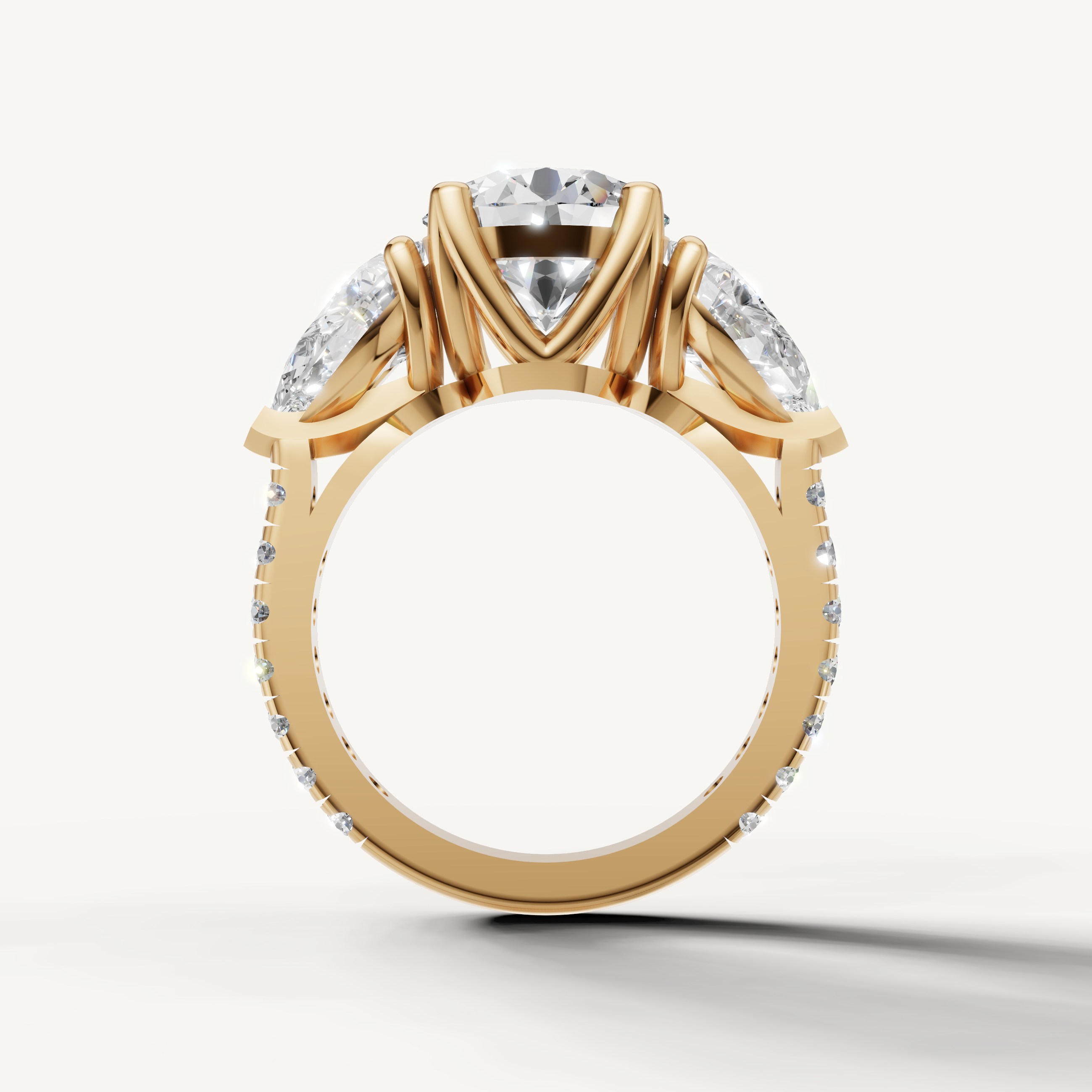 Close-up of Seo oval diamond ring with round side diamonds in yellow gold by Raul Diamonds.