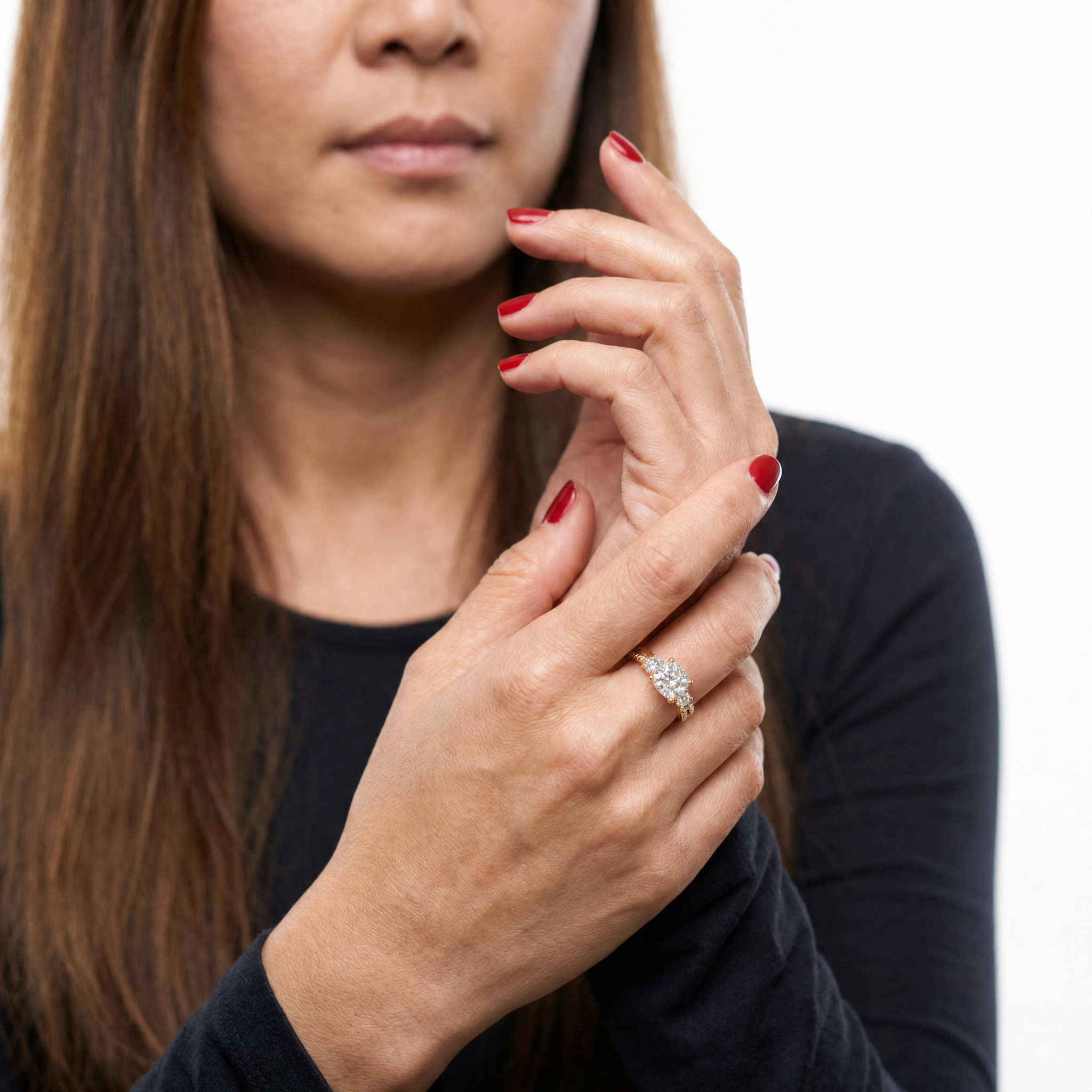 Elegant Model Wearing Cushion Cut Three Stone Lab Grown Diamond Engagement Ring in 14K Yellow Gold – Raul Diamonds