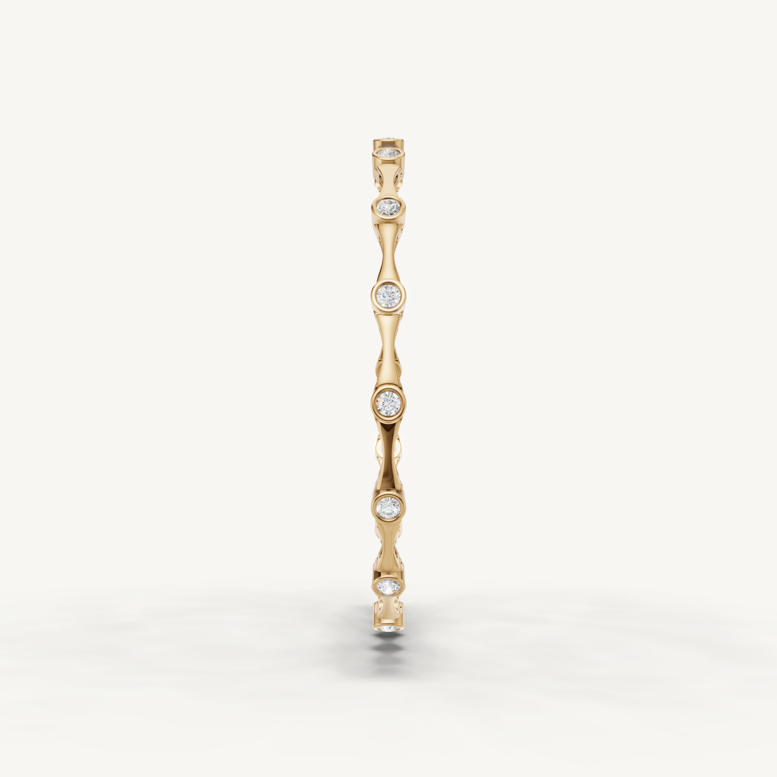 Elegant yellow gold diamond bracelet with minimalist bezel set stones by Raul Diamonds