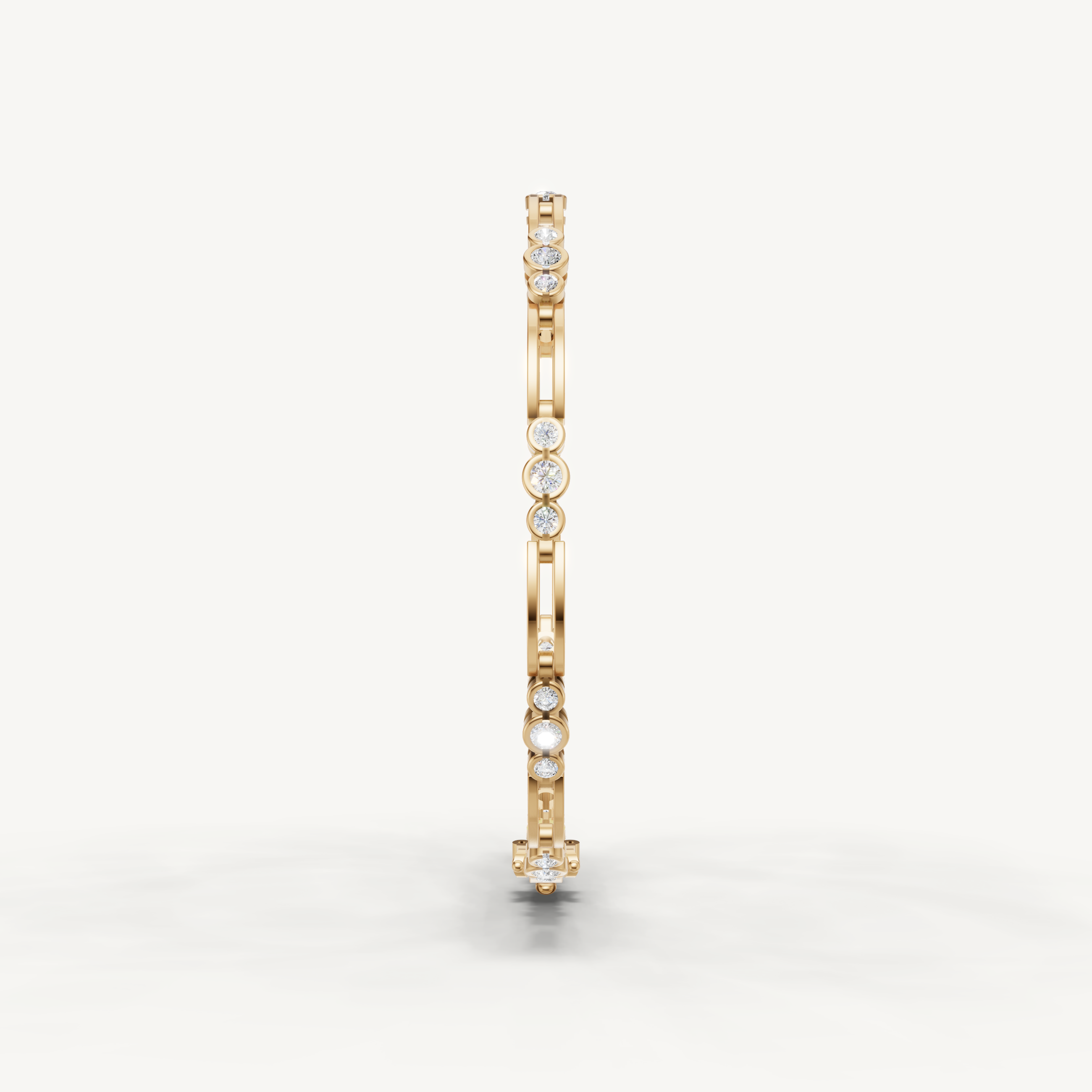 Elegant yellow gold diamond bracelet featuring bezel set round diamonds by Raul Diamonds
