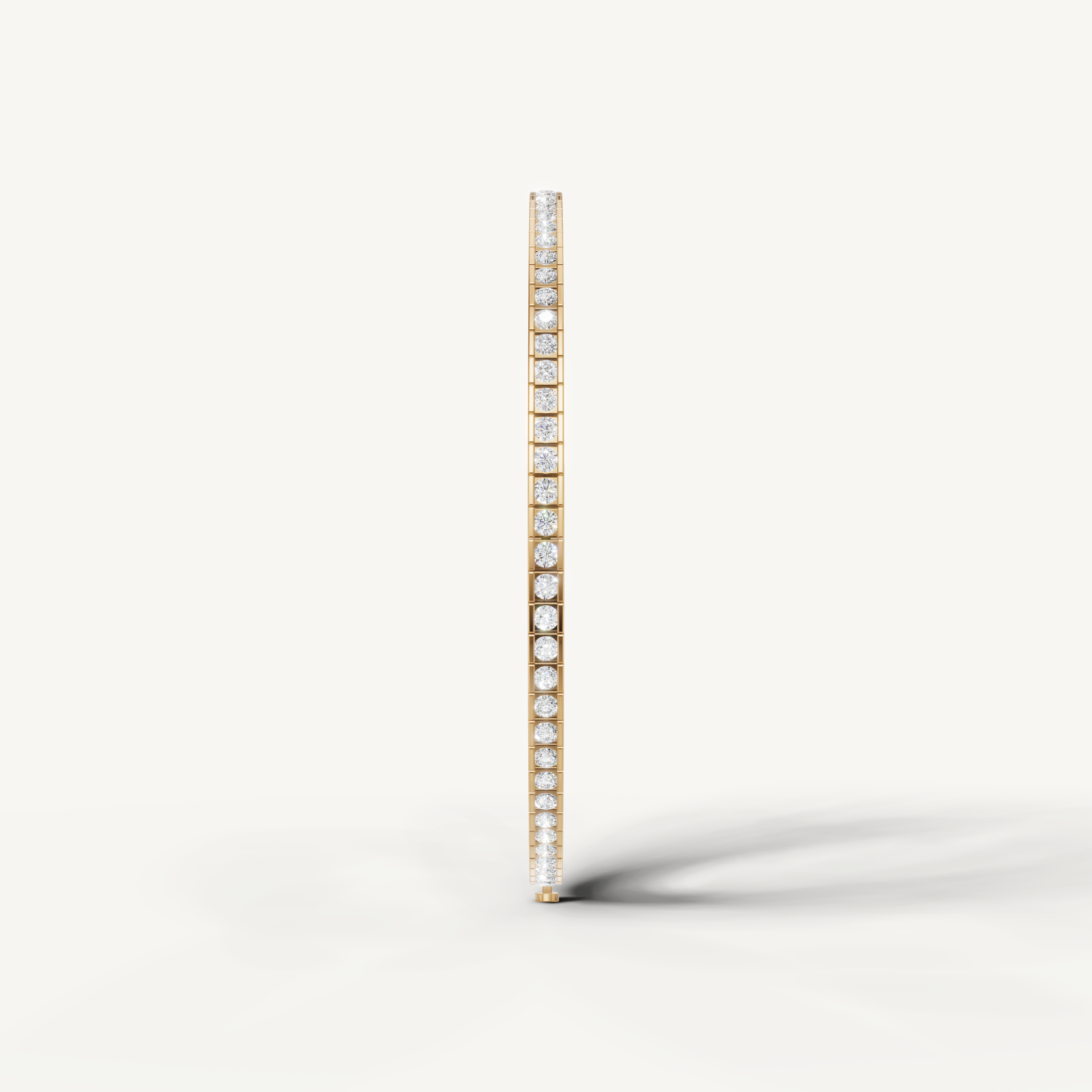Luxury yellow gold diamond bracelet featuring round bezel set diamonds by Raul Diamonds