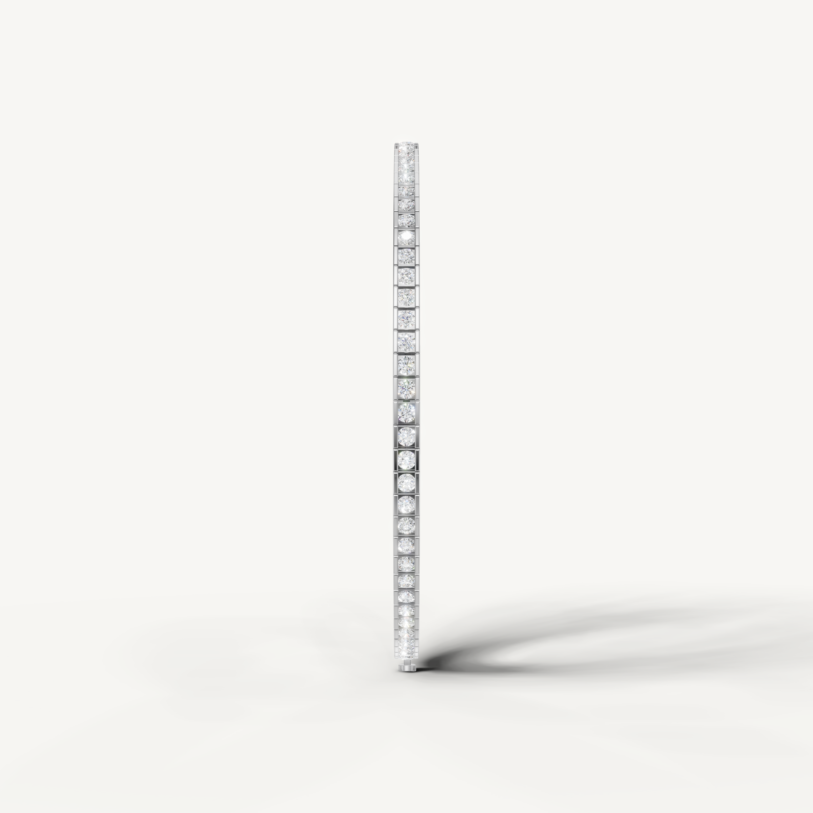 Luxury white gold diamond bracelet featuring round bezel set diamonds by Raul Diamonds