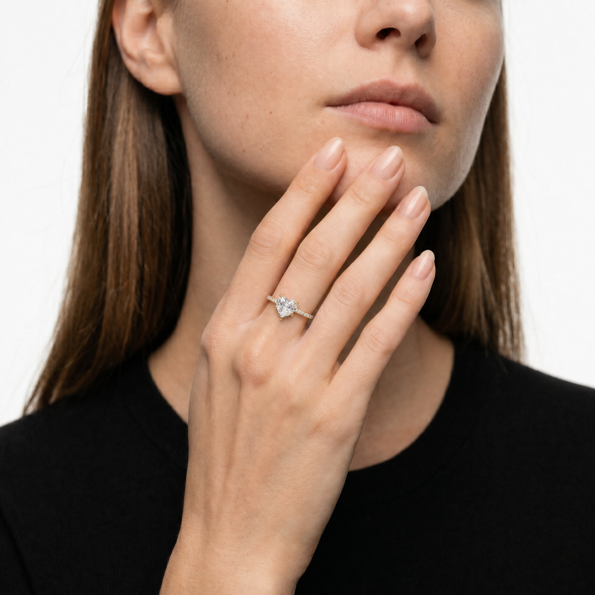 Elegant Model Wearing Heart Shape Lab Grown Diamond Engagement Ring in 14K Yellow Gold – Raul Diamonds