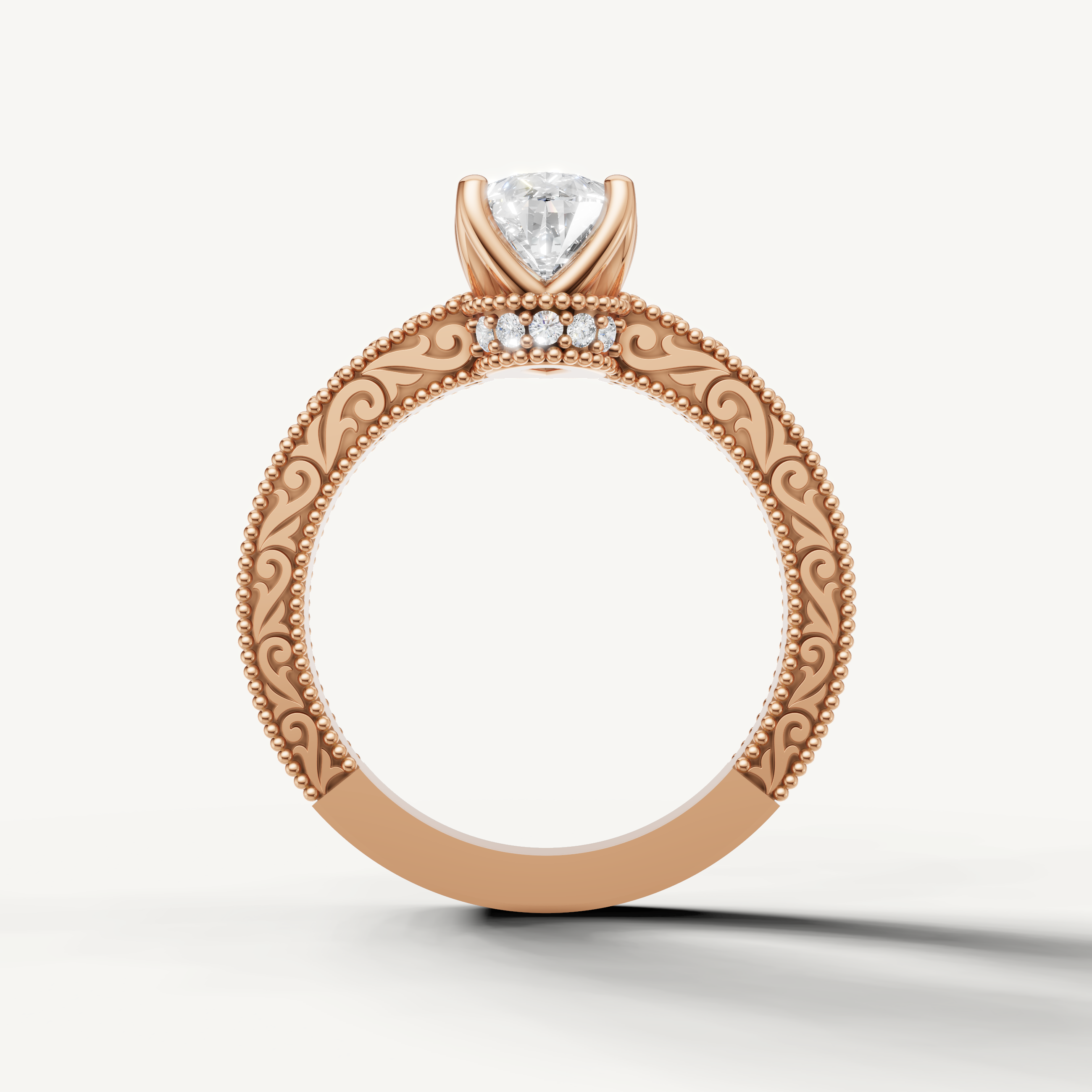 Pear cut lab grown diamond engagement ring in rose gold with elegant vintage detailing and round accent diamonds by Raul Diamonds.