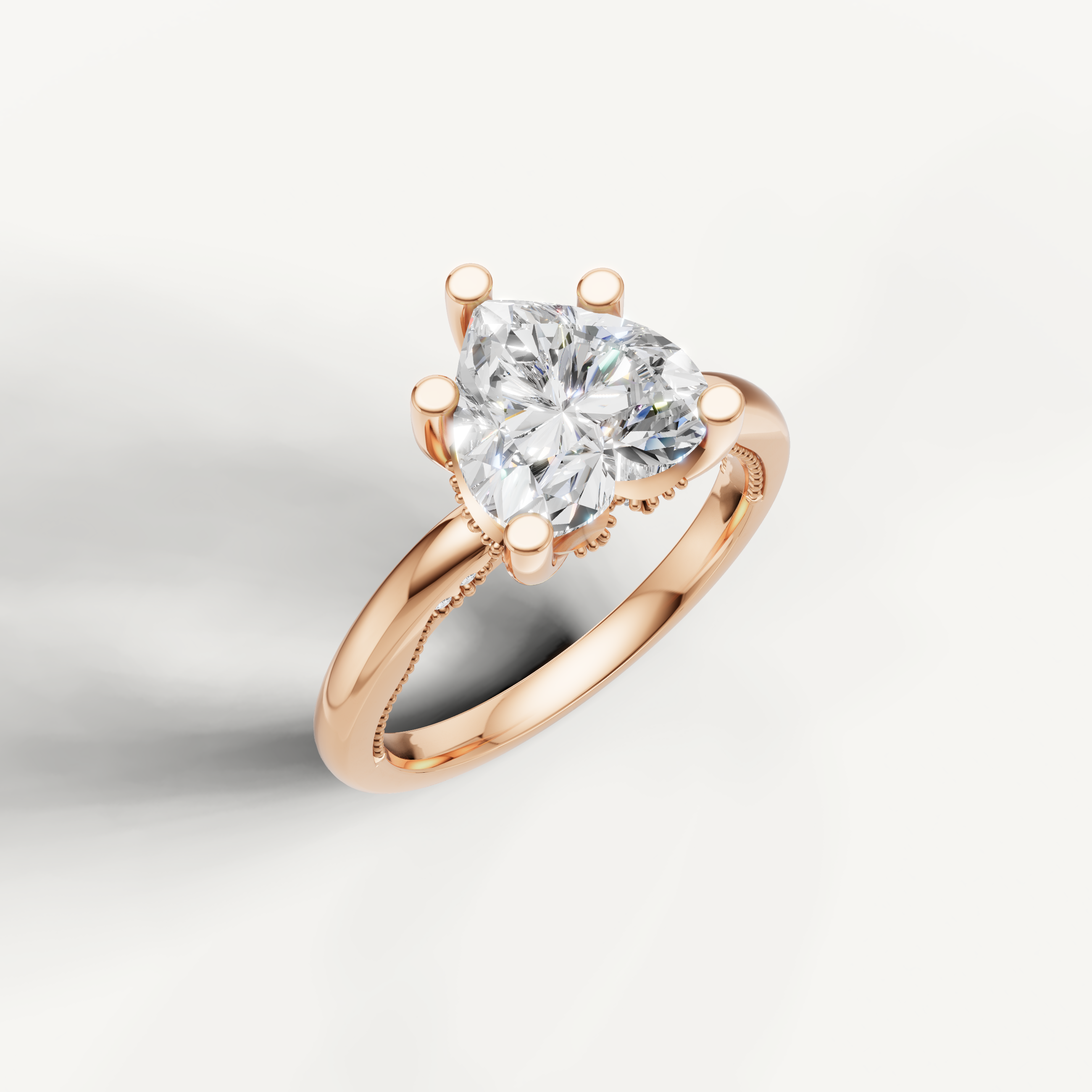 A soft rose gold ring highlighting the sweet, iconic shape of a heart-cut center stone on a polished, rounded band.