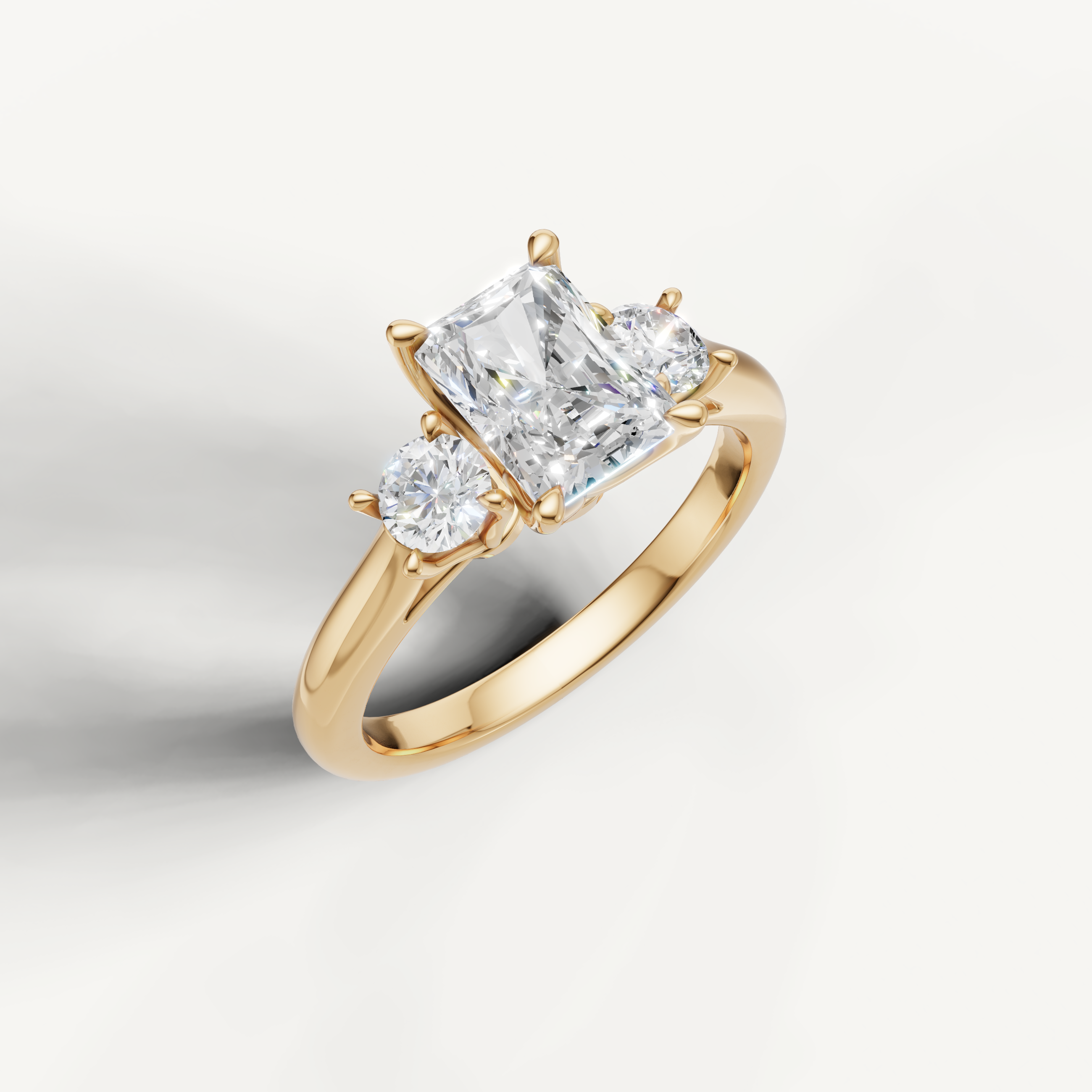 IGI certified radiant lab diamond ring with round side stones yellow gold DEF VVS