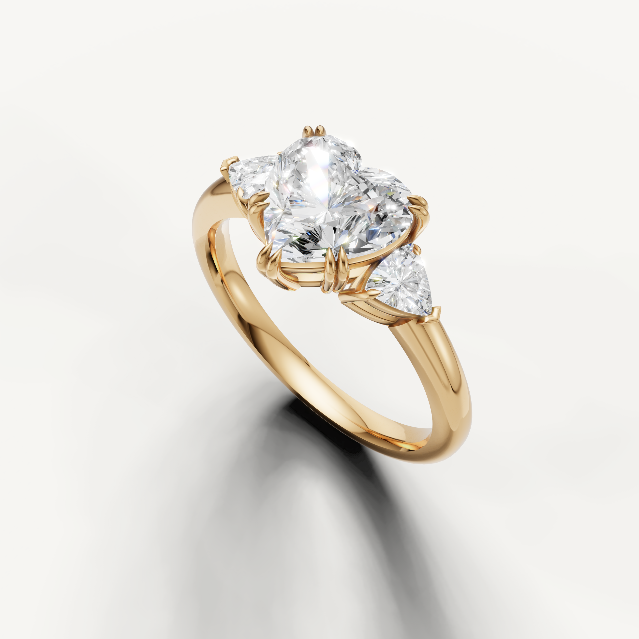 elegant heart shaped lab grown diamond engagement ring with pear-inspired trillion side diamonds