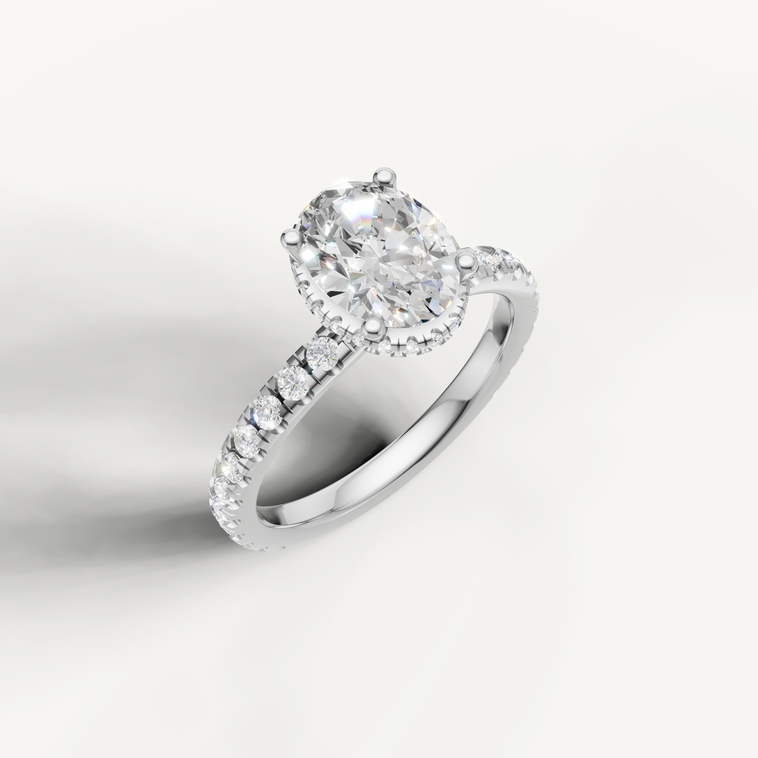 elegant oval solitaire ring with pavé diamond shank and hidden halo