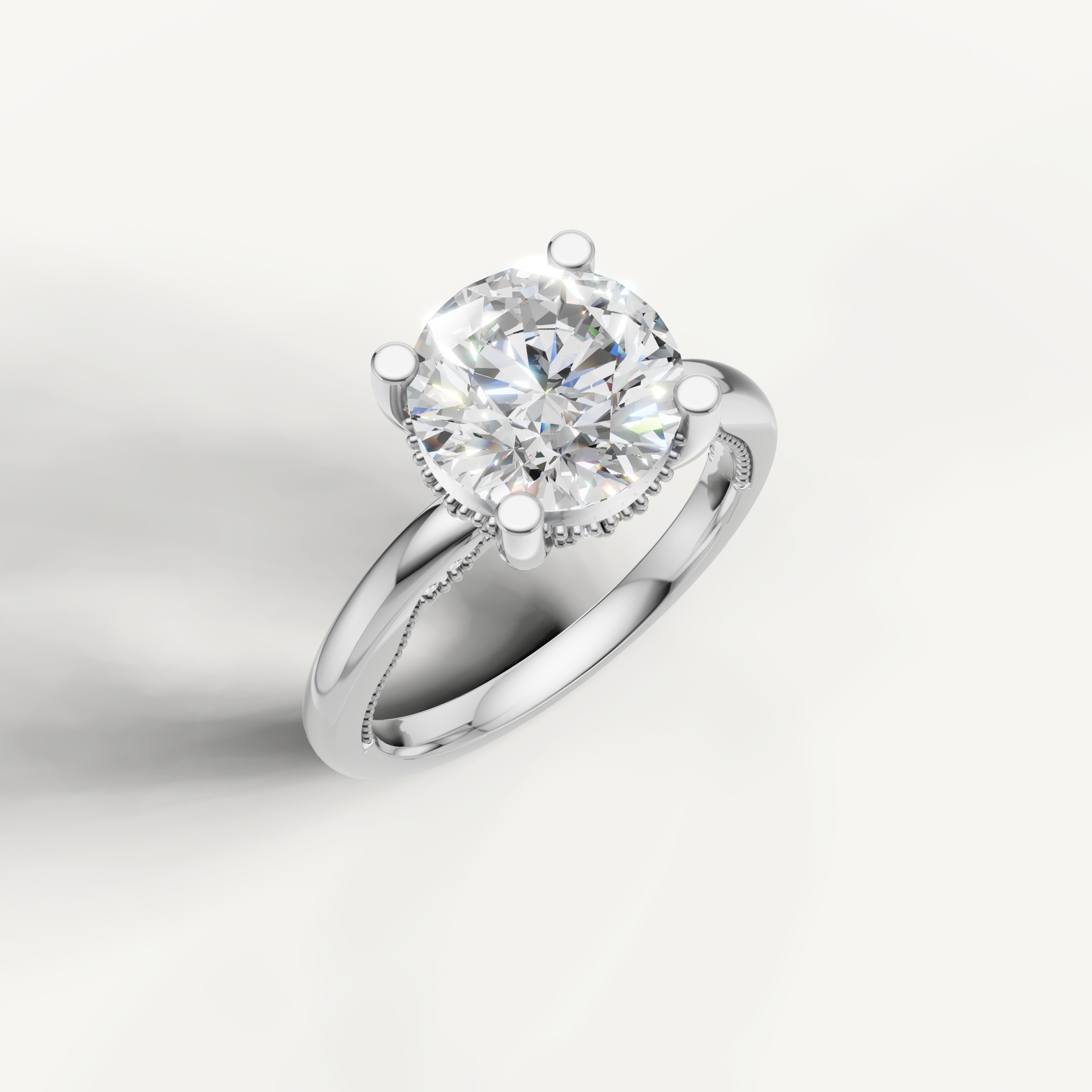 A sleek, silvery-white band holding a prominent round-cut center stone, designed for a clean and elegant profile.