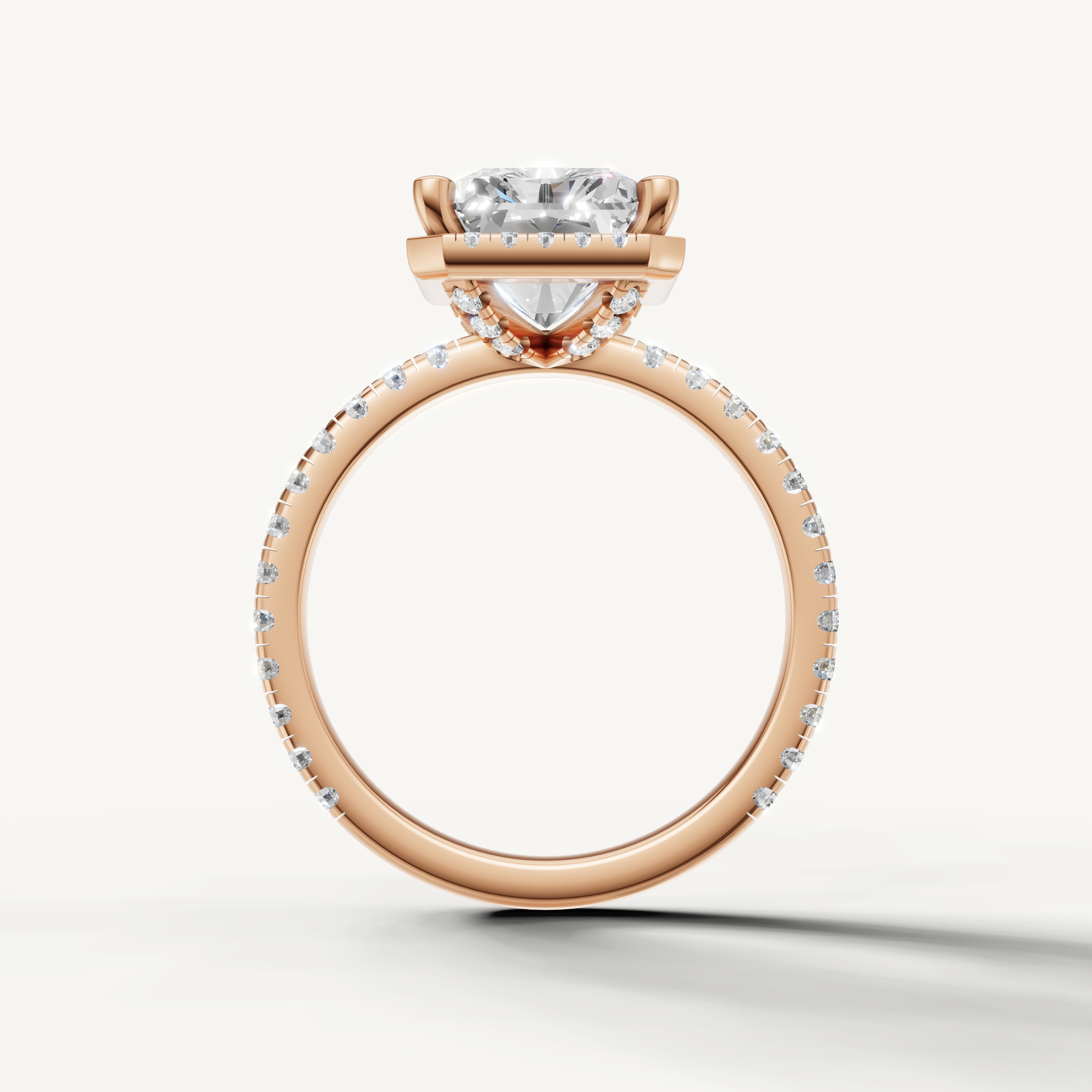 Radiant shape diamond engagement ring with pavé band and hidden halo rose gold
