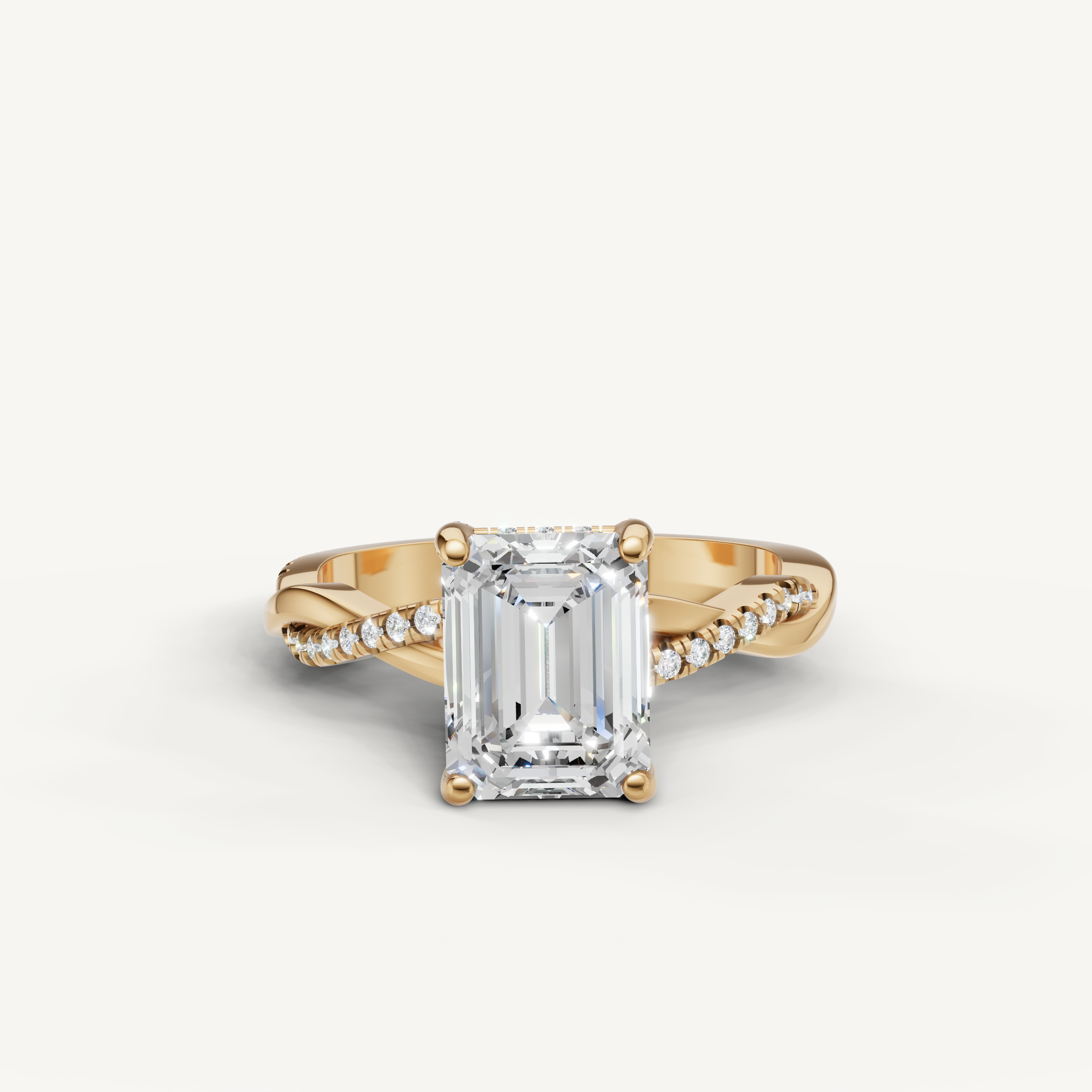 Raul Diamonds emerald cut diamond engagement ring in 18k yellow gold featuring a signature twisted pavé band