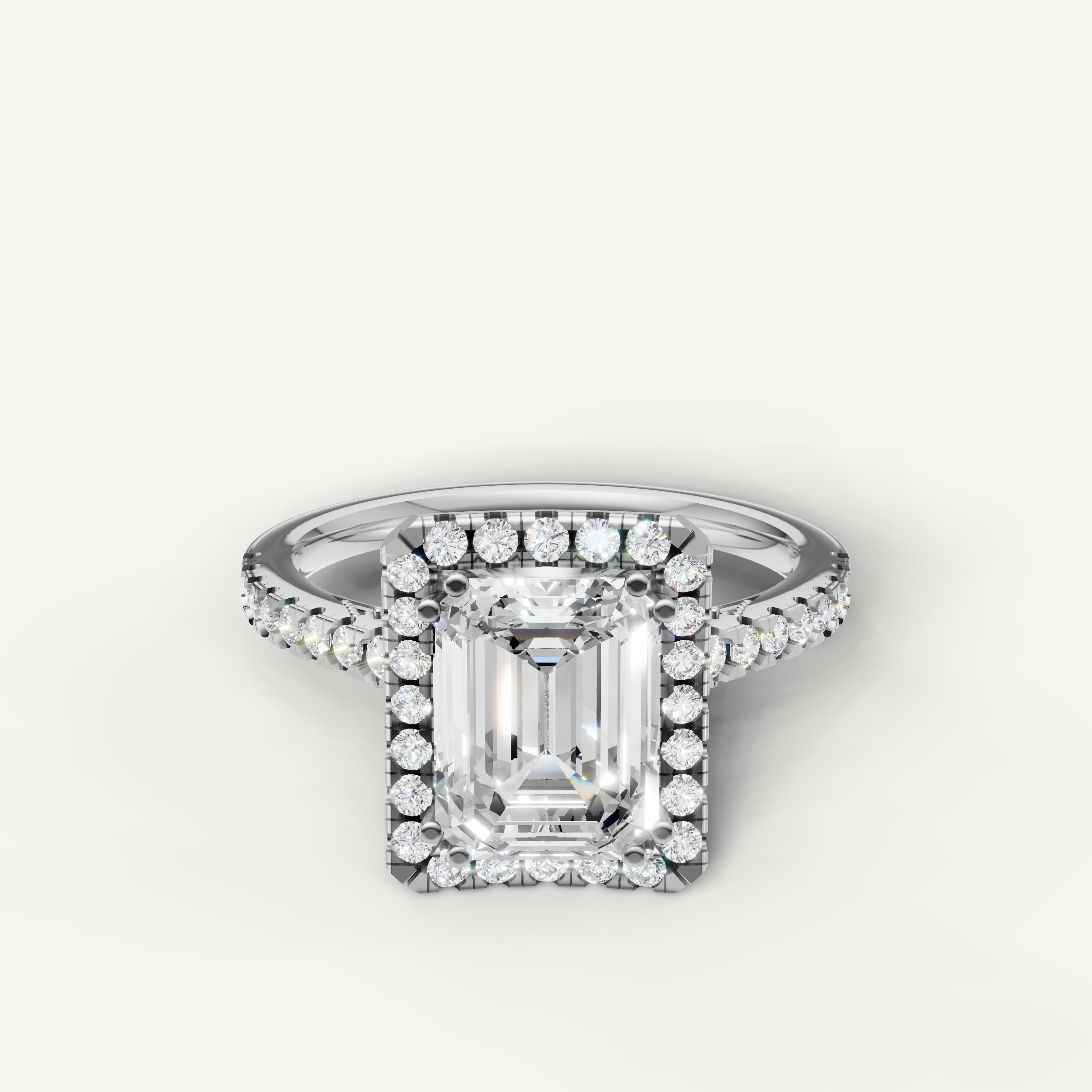 Emerald cut lab grown diamond halo engagement ring in 14K white gold with pavé diamond band by Raul Diamonds