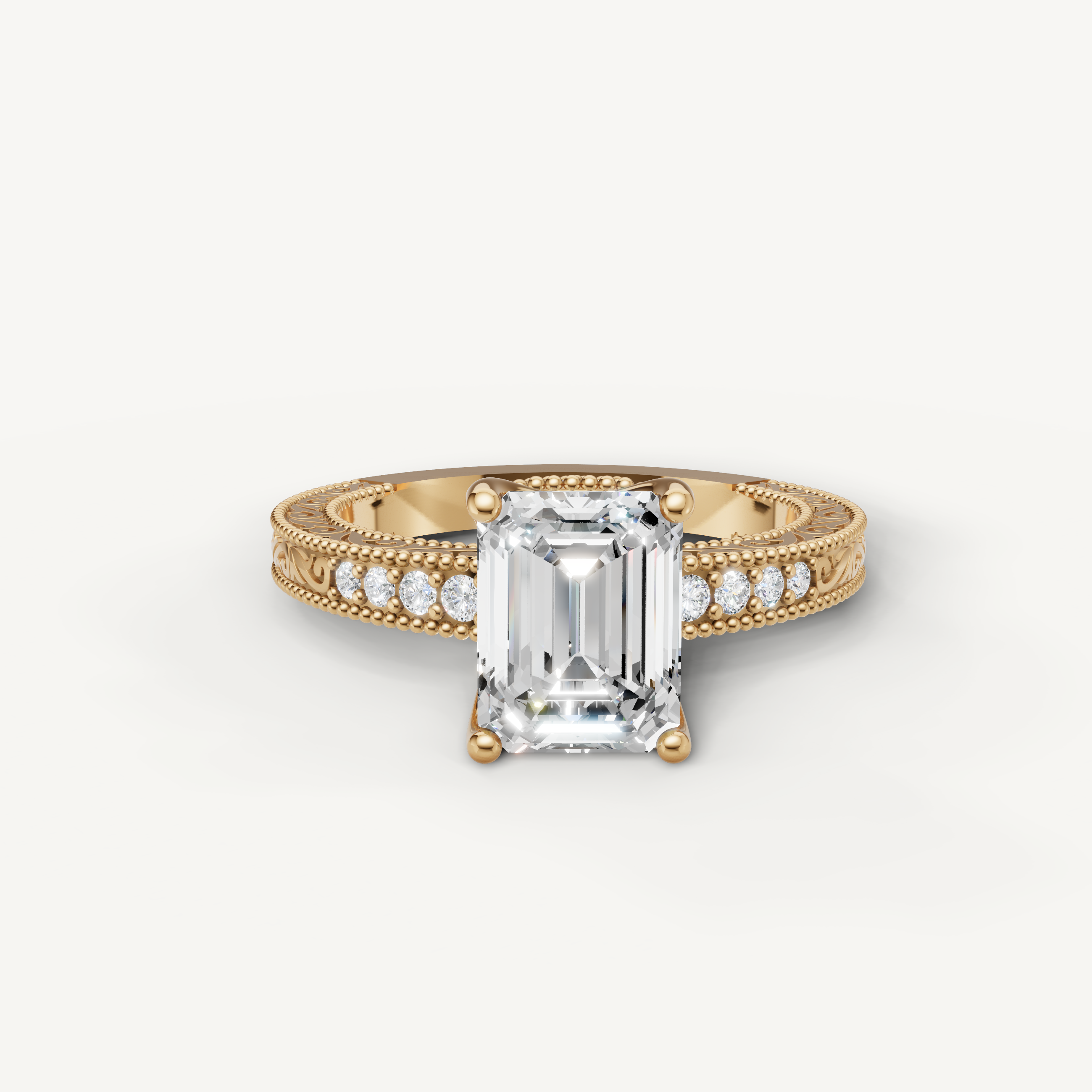 Vintage emerald cut lab grown diamond engagement ring in 14K yellow gold with intricate filigree and pavé detailing by Raul Diamonds.