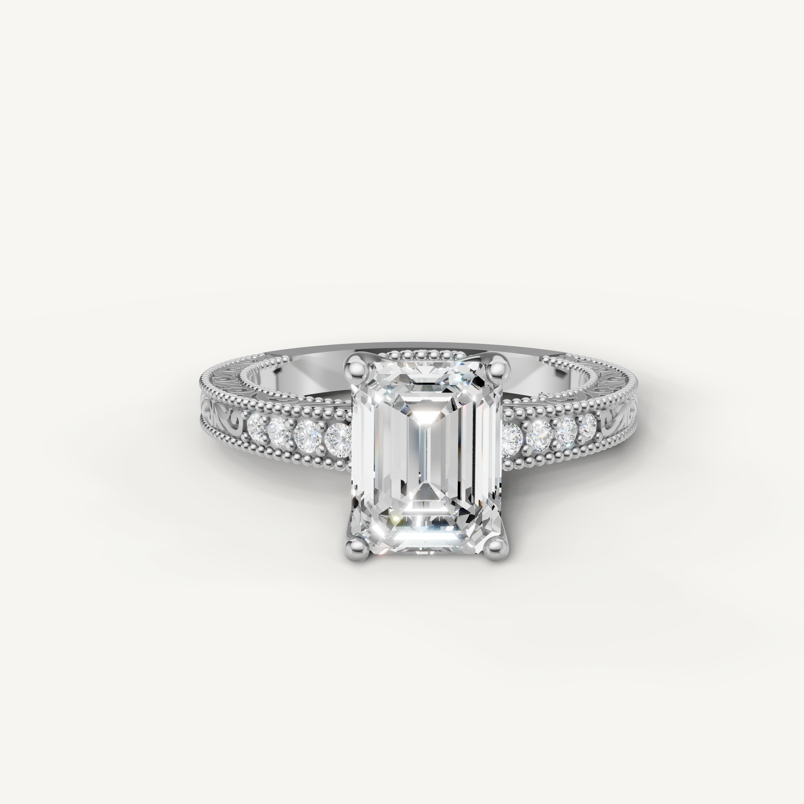 Vintage emerald cut lab grown diamond engagement ring in 14K white gold with ornate filigree and pavé accents by Raul Diamonds.