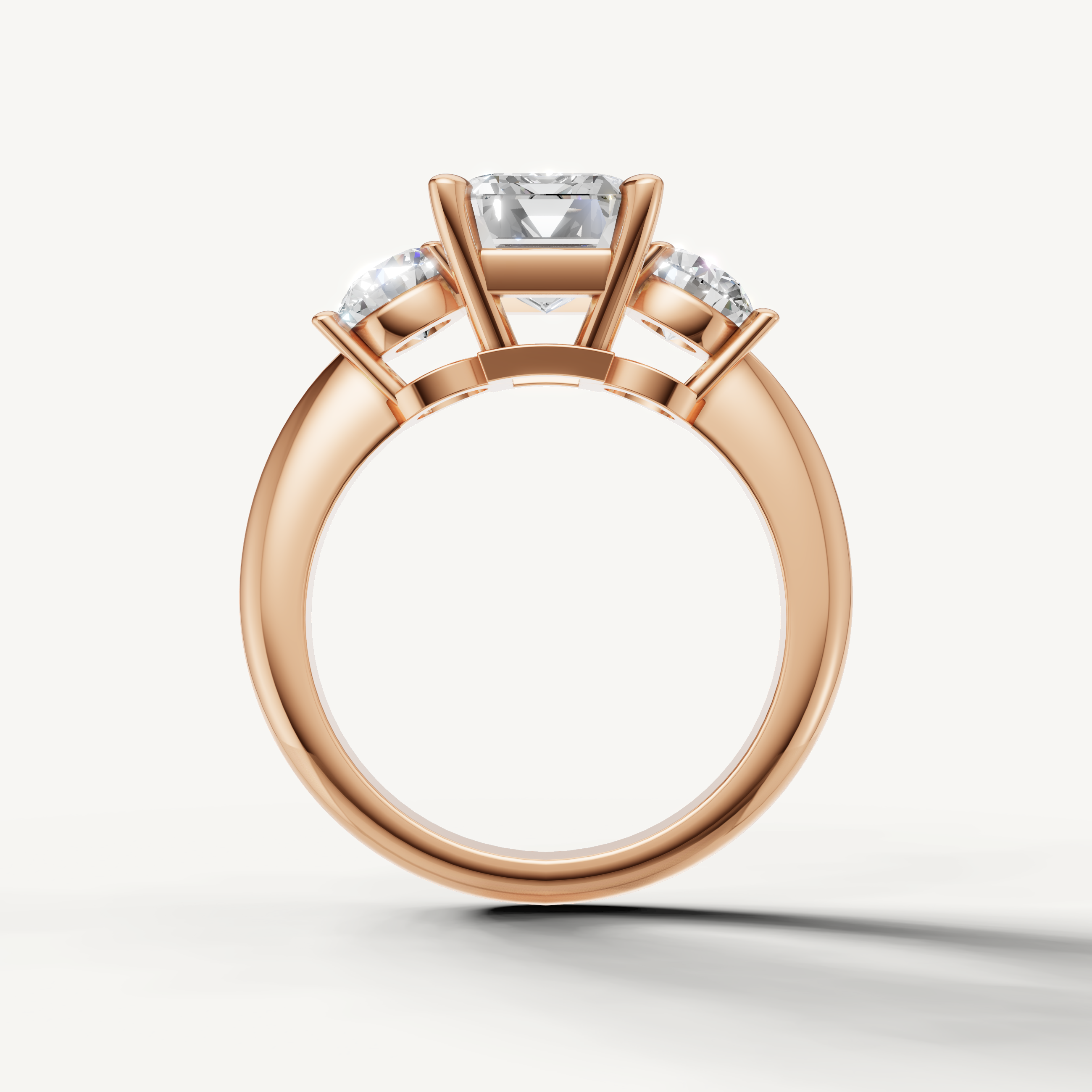 Elegant emerald lab grown diamond ring with round side stones rose gold