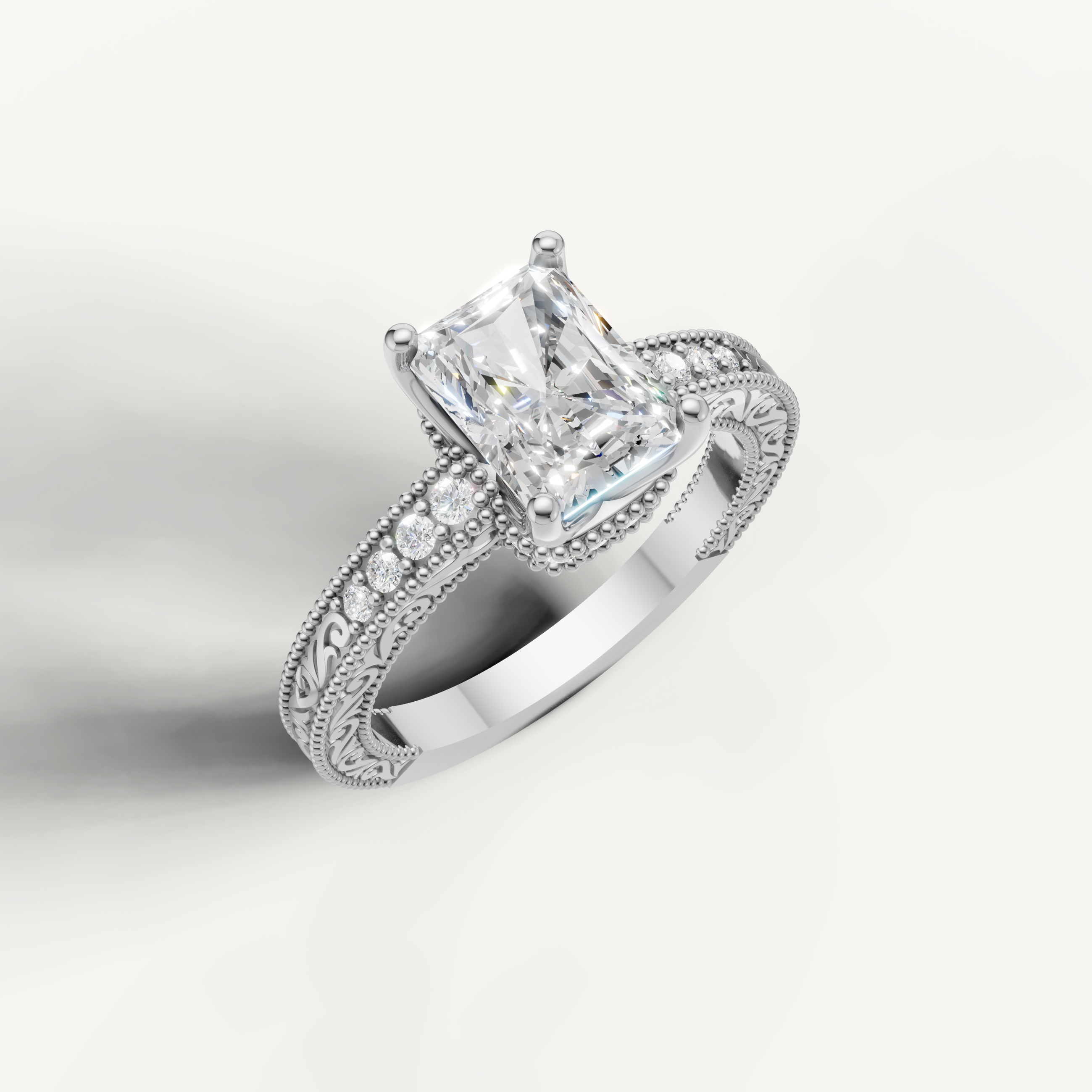 White gold radiant cut lab grown diamond ring featuring antique-style scrollwork and milgrain craftsmanship by Raul Diamonds.