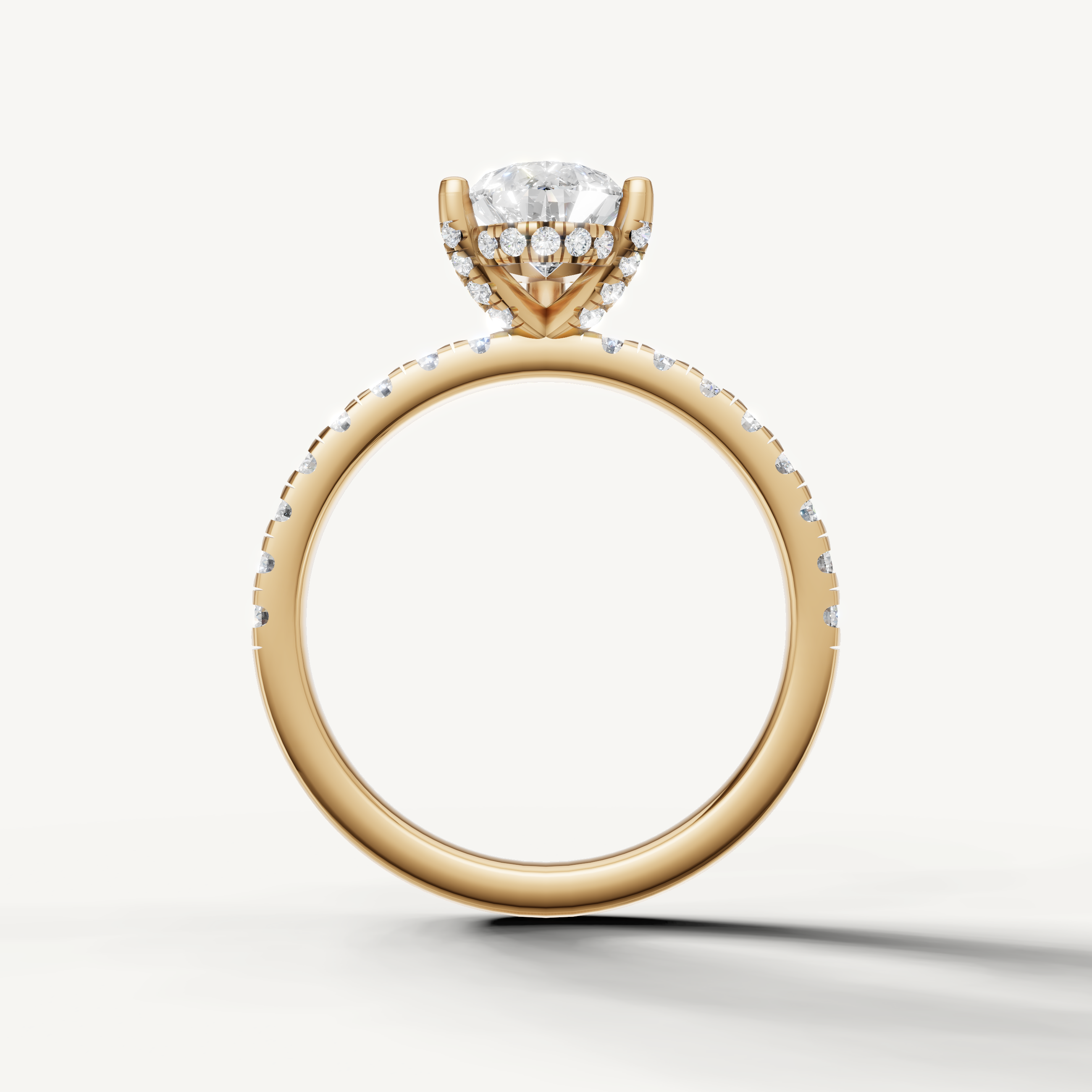 pear shaped lab grown diamond ring with pavé band yellow gold