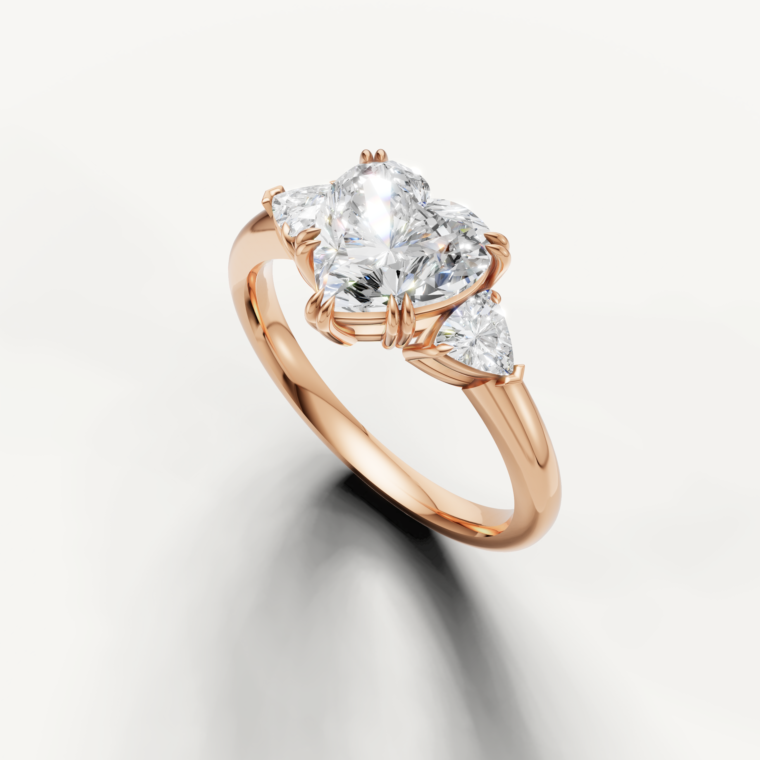 elegant heart shaped lab grown diamond ring with polished rose gold and trillion side diamonds