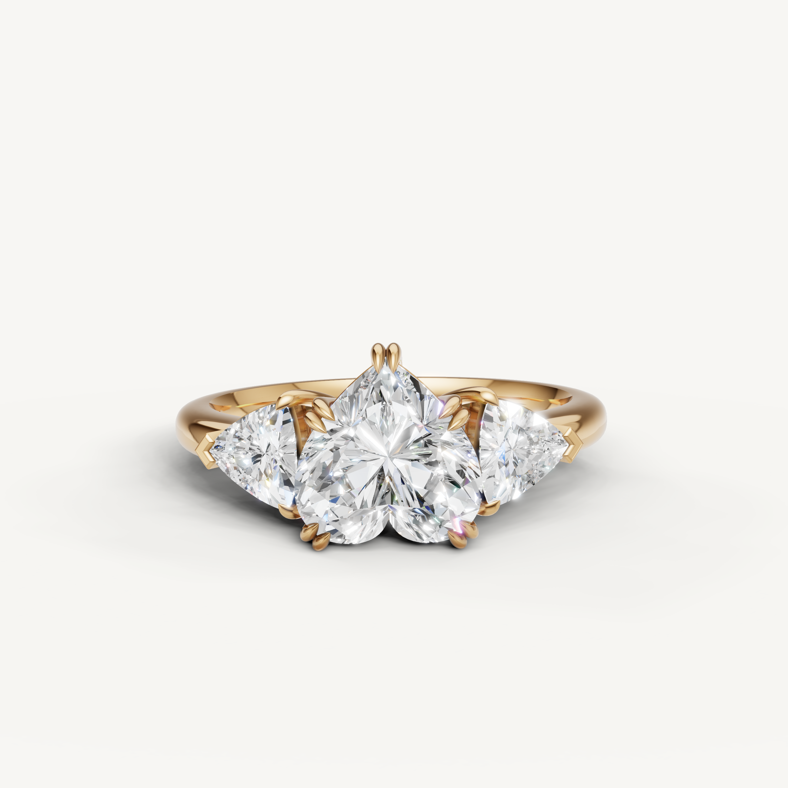 heart cut lab grown diamond engagement ring with trillion side stones in 14k yellow gold