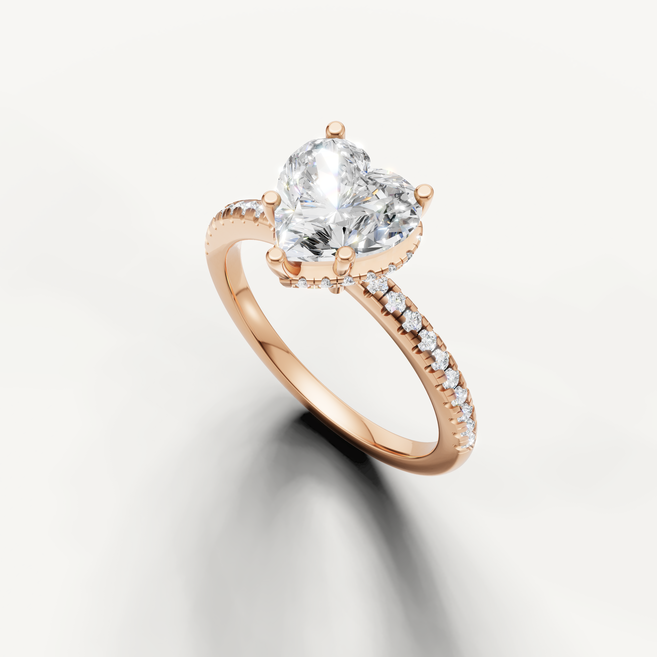 heart shaped diamond engagement ring with delicate pavé band and hidden halo rose gold