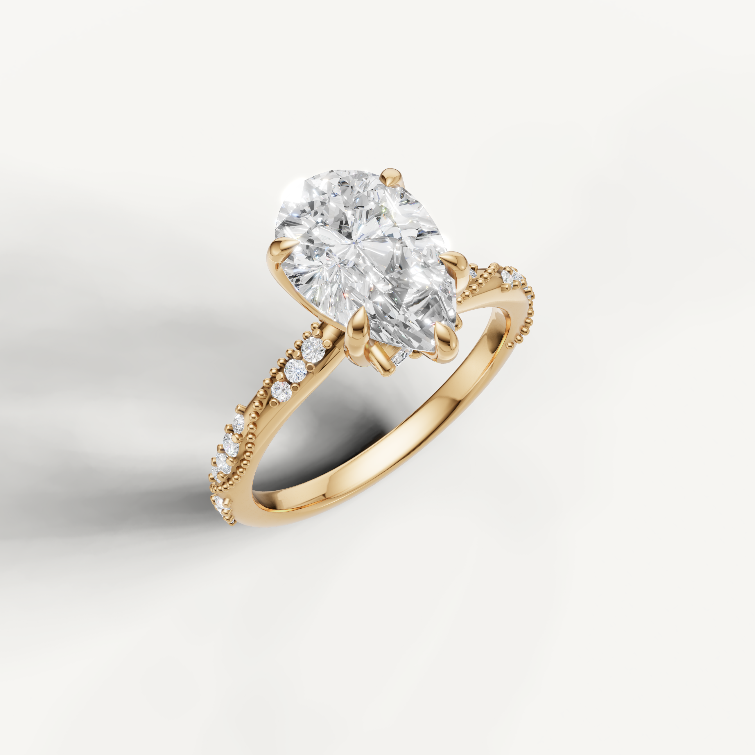 IGI certified pear lab diamond ring with crossover pavé shank 14k yellow gold