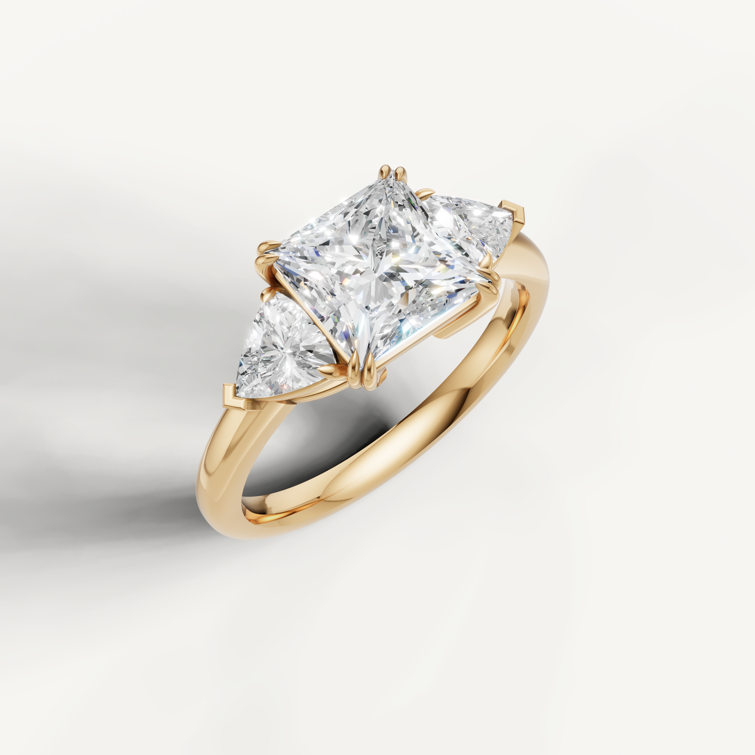 elegant princess cut lab grown diamond trilogy ring with tapered trillion accents