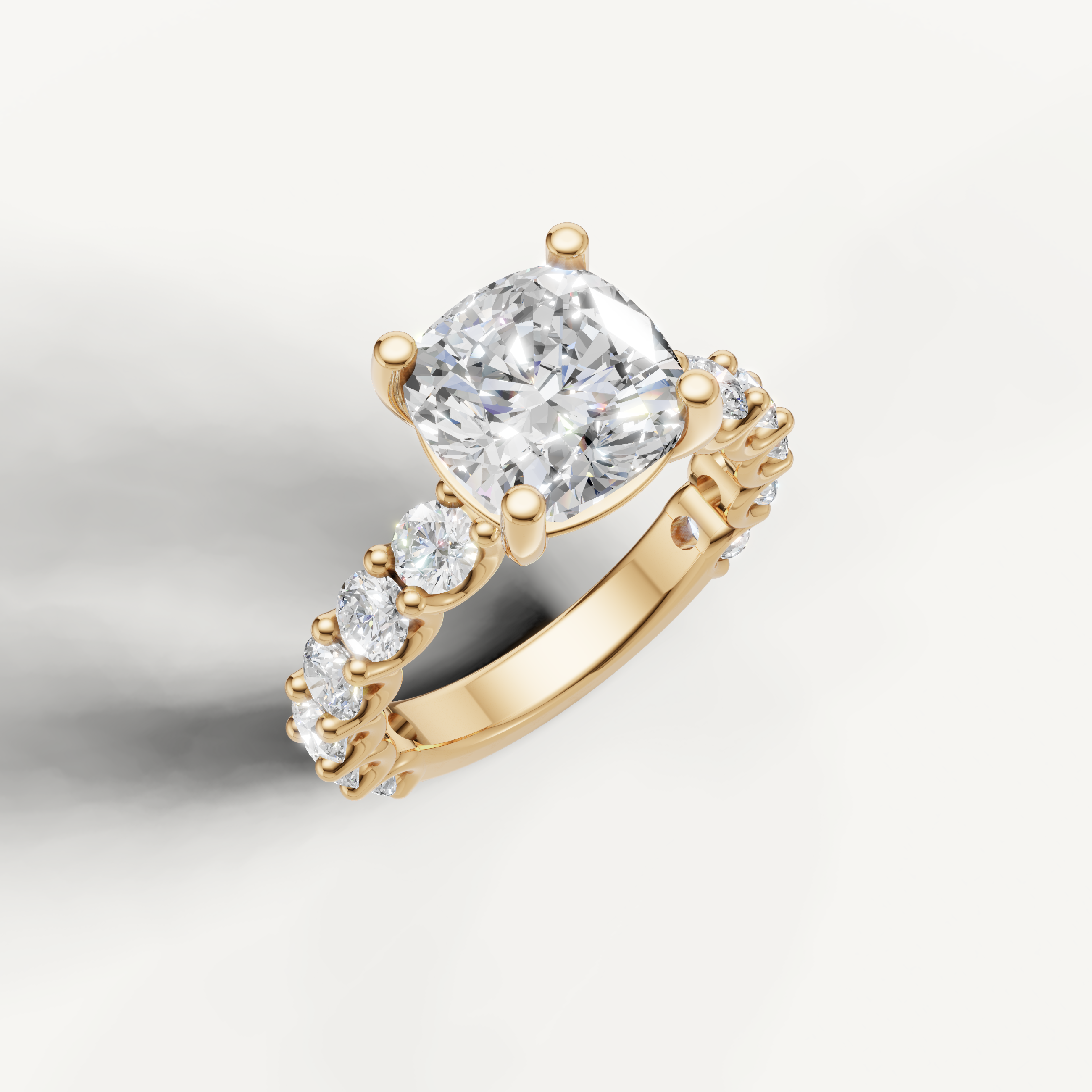 IGI certified cushion lab diamond solitaire ring with scalloped shared prong band yellow gold