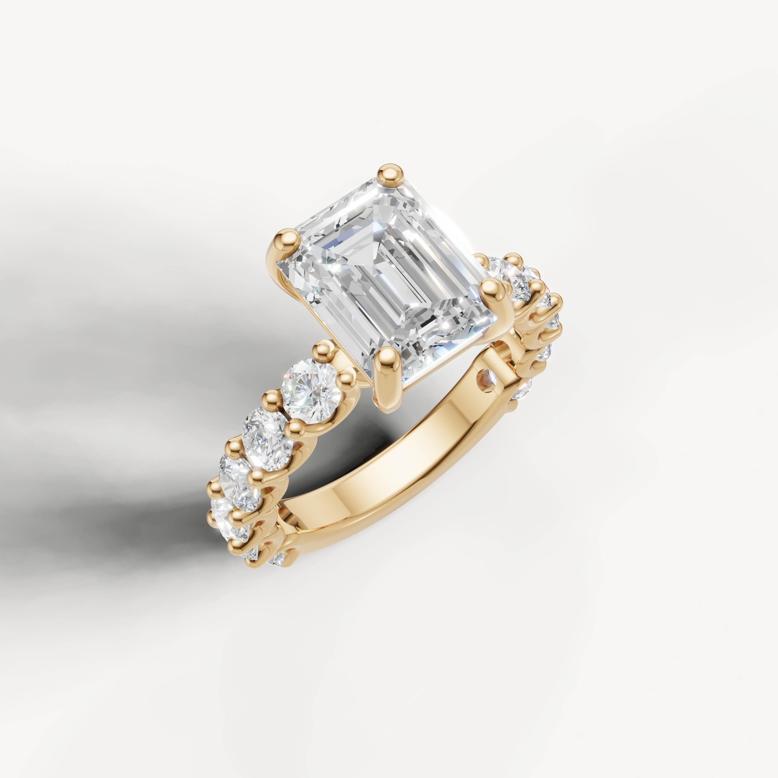 IGI certified emerald lab diamond ring with round side diamonds shared prong band yellow gold