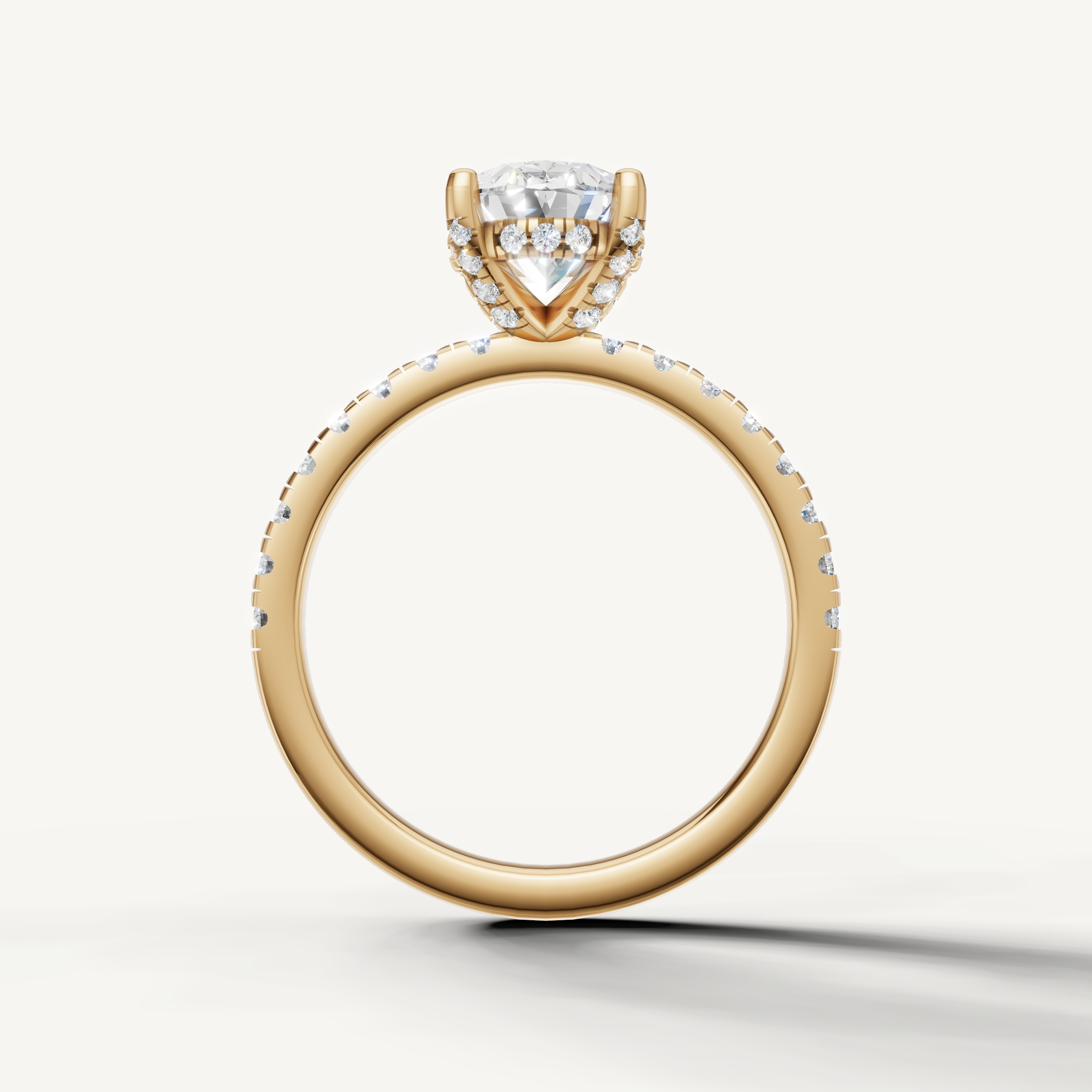 elongated oval lab grown diamond ring with pavé band yellow gold