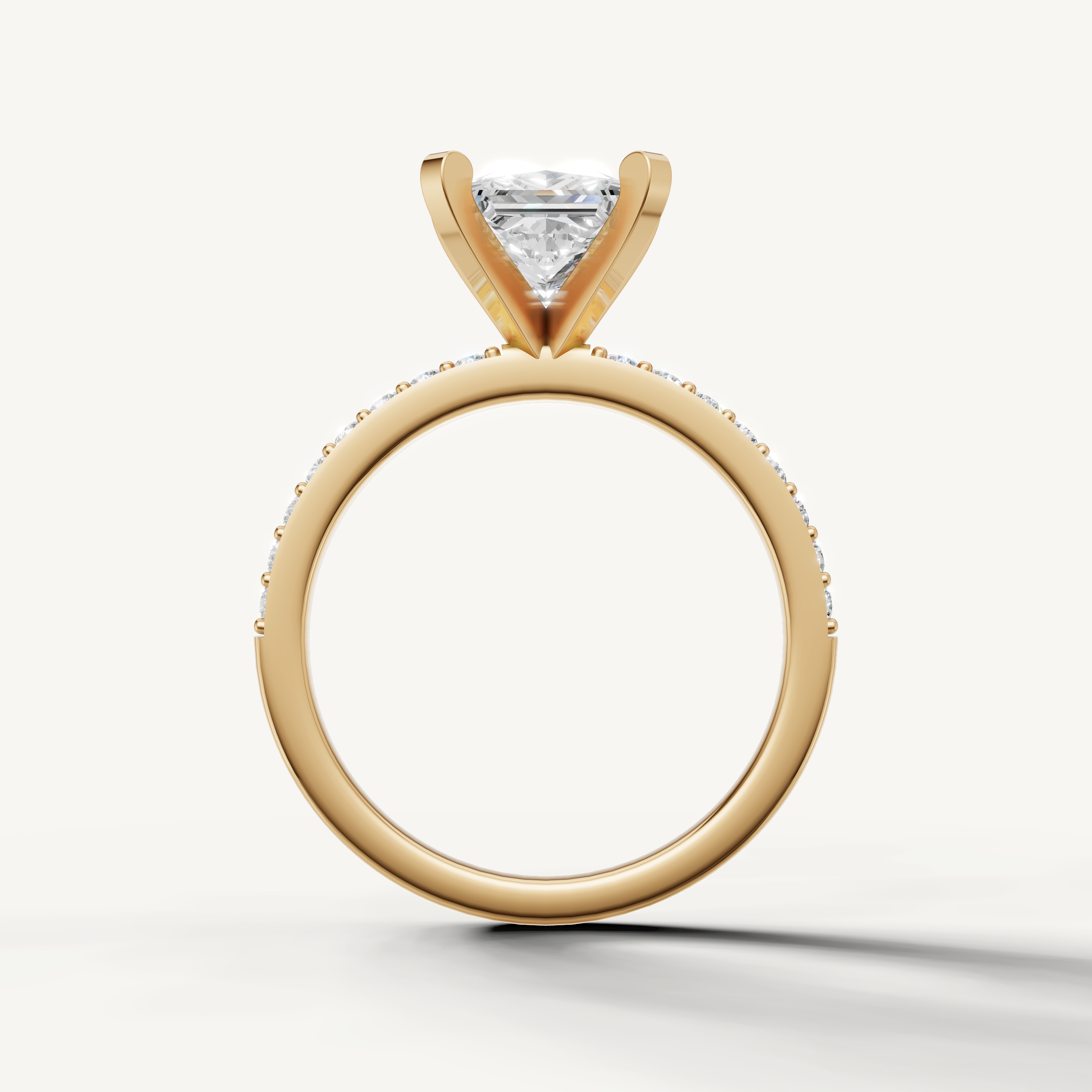 Elegant princess cut diamond ring in yellow gold slim pavé engagement setting