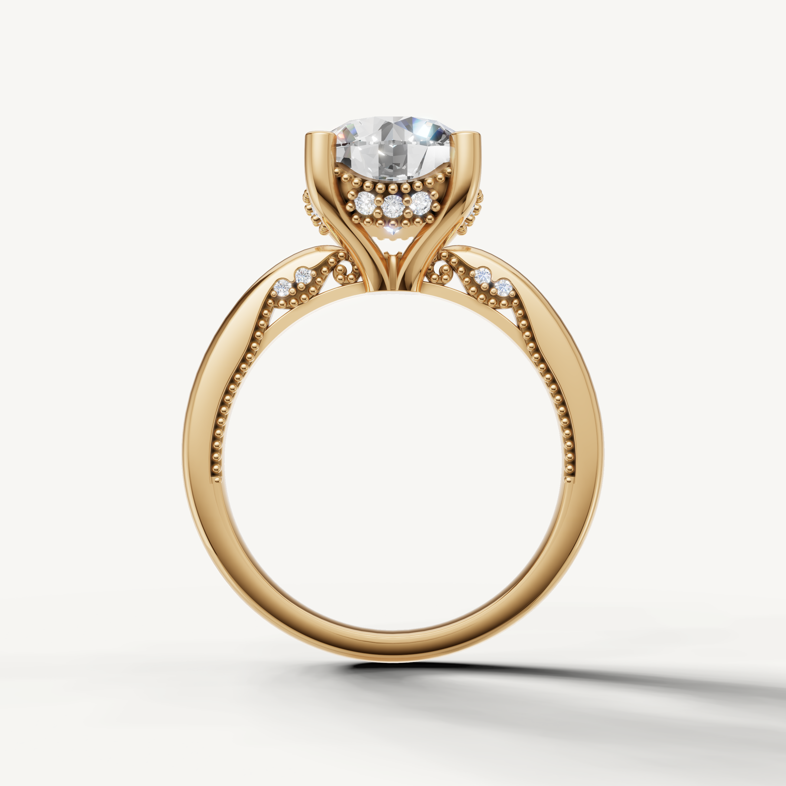 A sleek, contemporary yellow gold solitaire ring that focuses attention on the radiant, multifaceted round brilliant diamond.