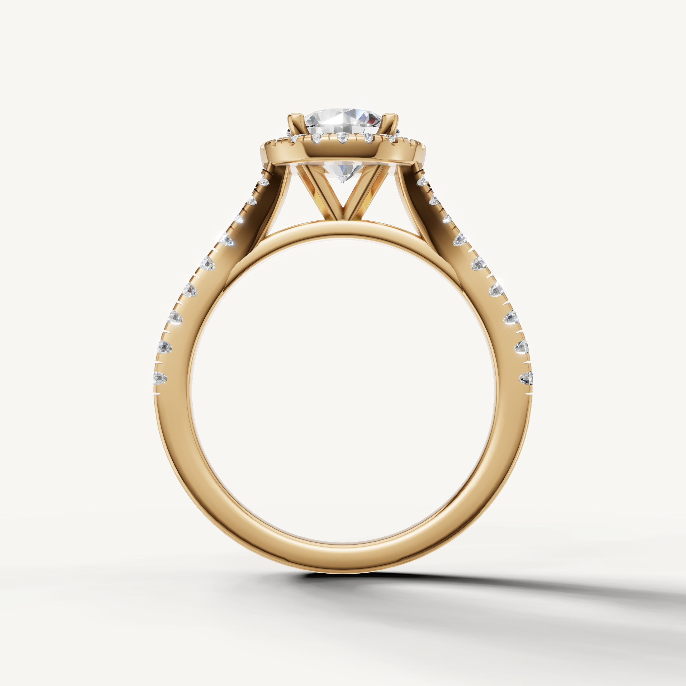 Elegant round cut halo engagement ring with pavé diamonds yellow gold