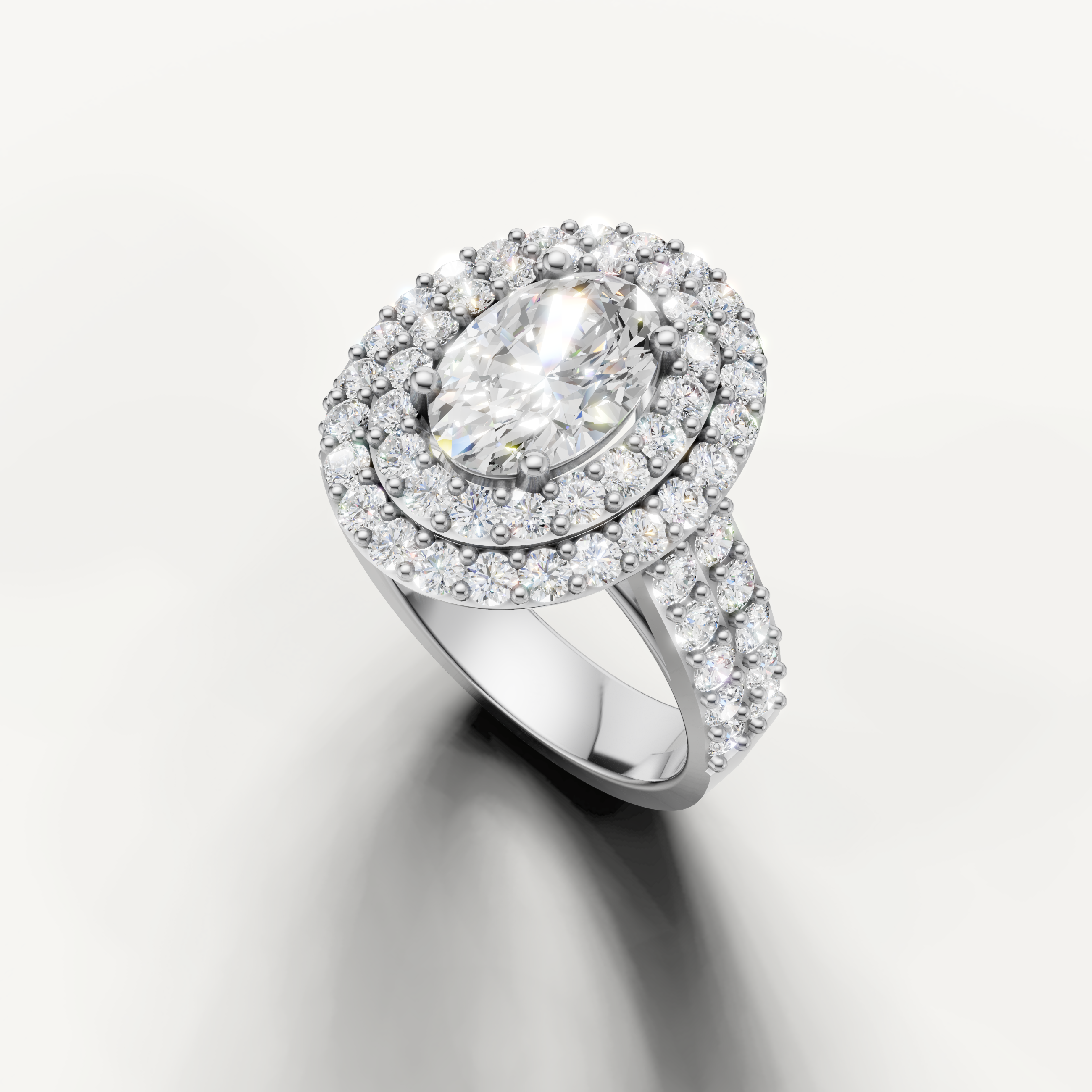Handcrafted oval halo engagement ring by Raul Diamonds in luxury gold setting