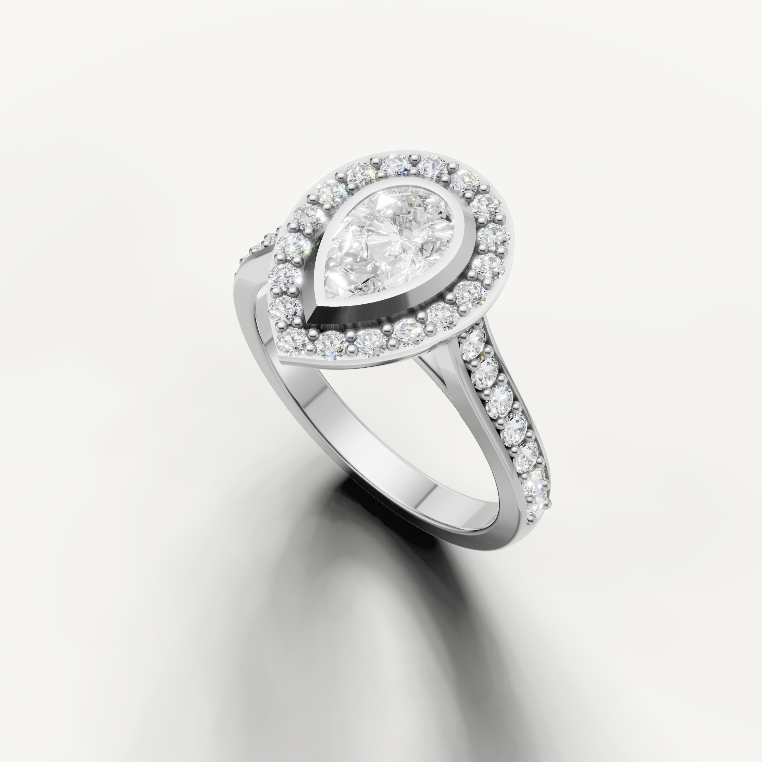 Handcrafted pear halo engagement ring by Raul Diamonds in luxury gold setting