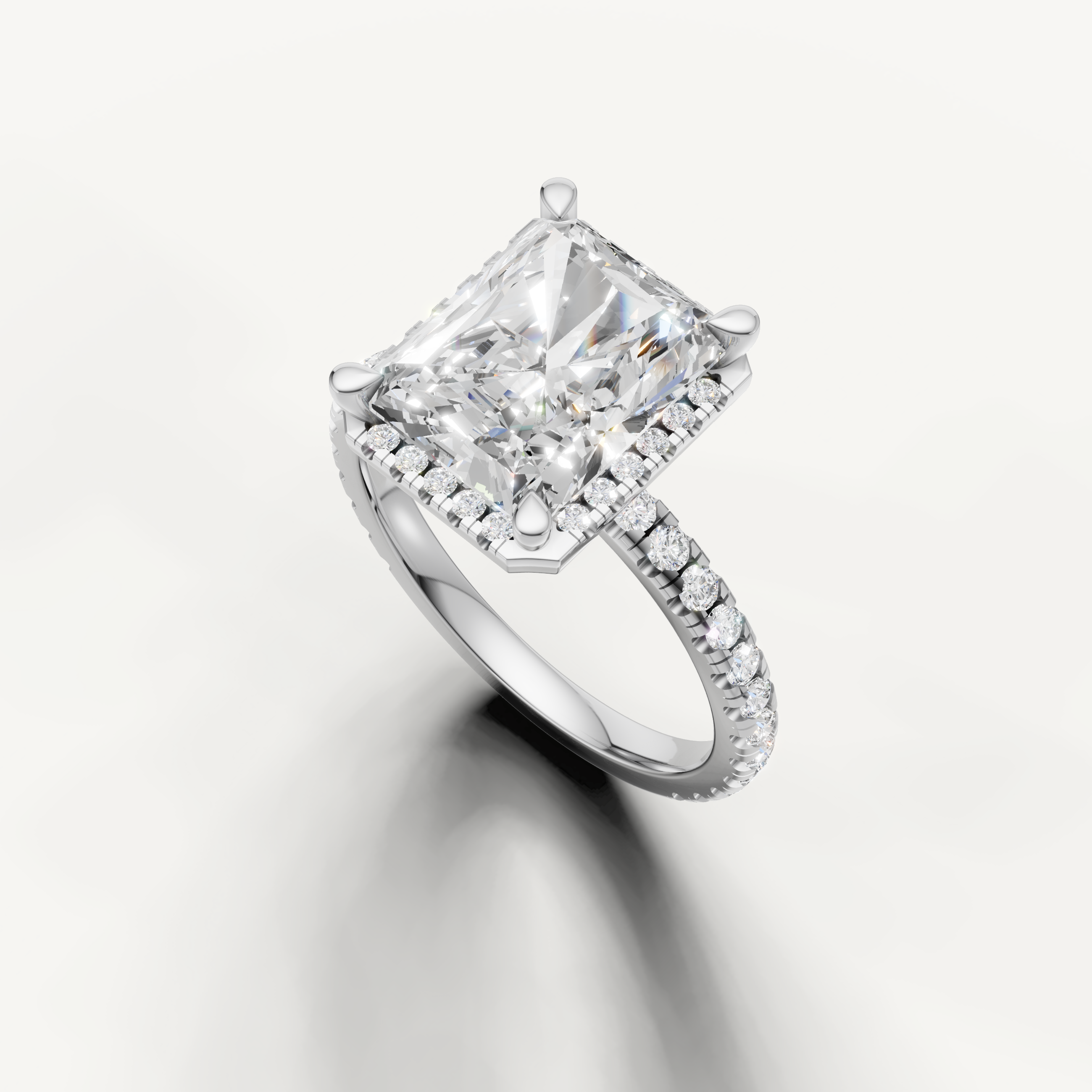 Rectangular radiant lab diamond ring with hidden halo and pavé band white gold