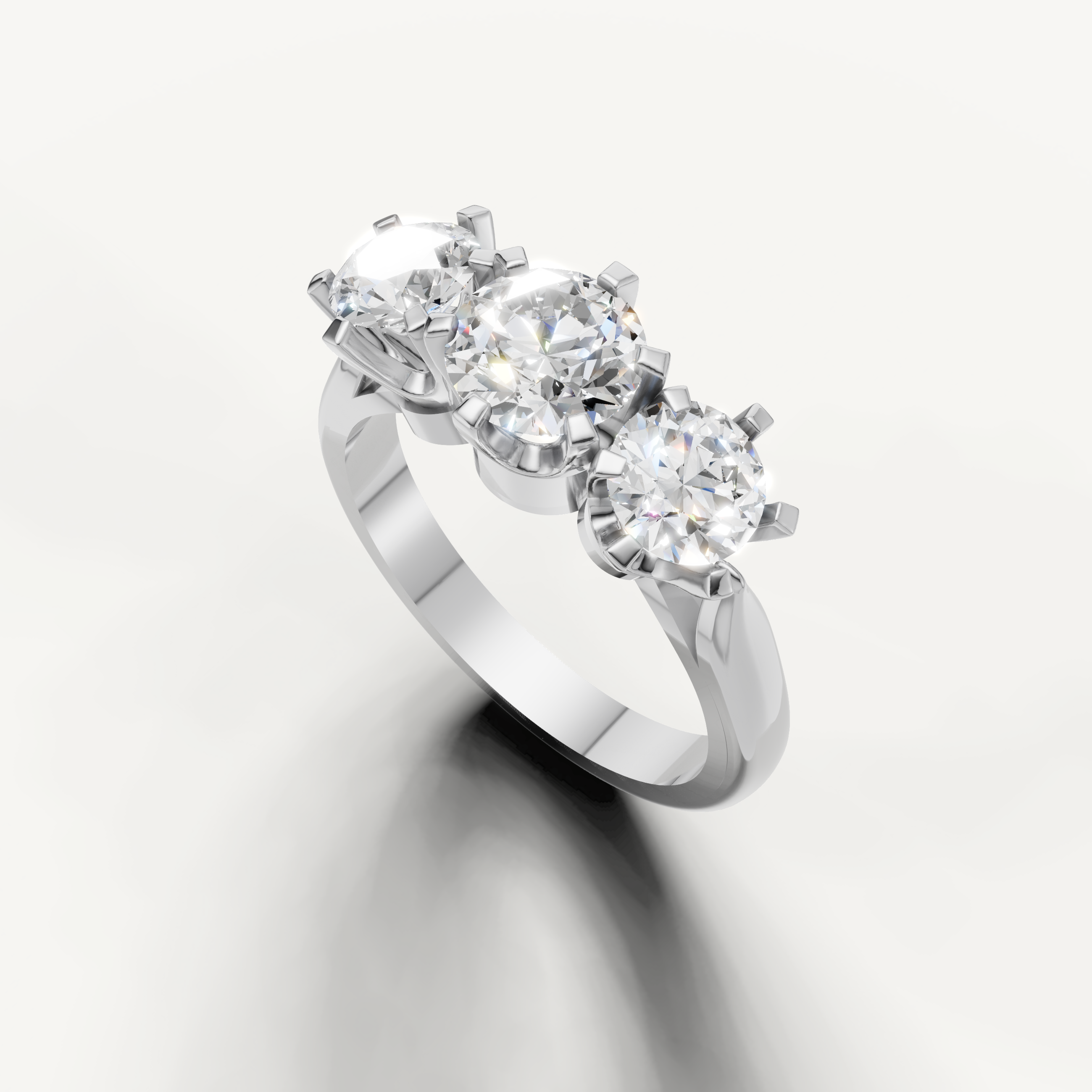 Handcrafted round three stone engagement ring by Raul Diamonds in luxury gold setting