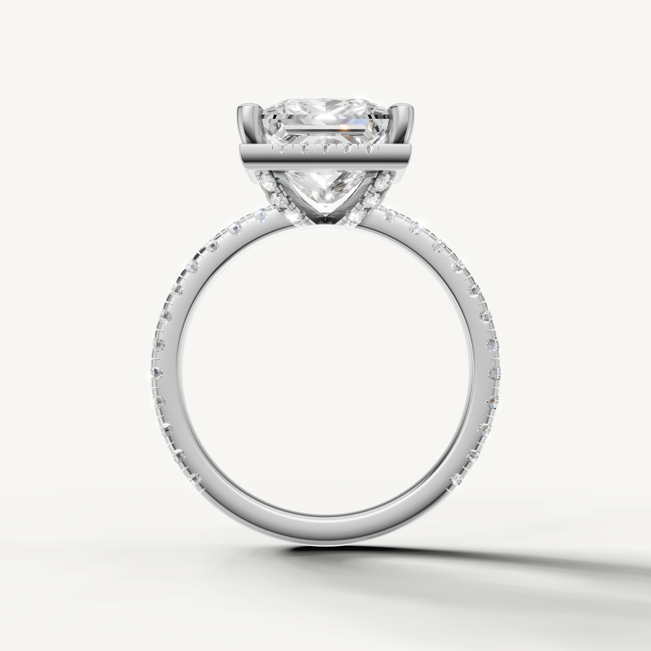 Princess shape diamond engagement ring with pavé band and hidden halo white gold