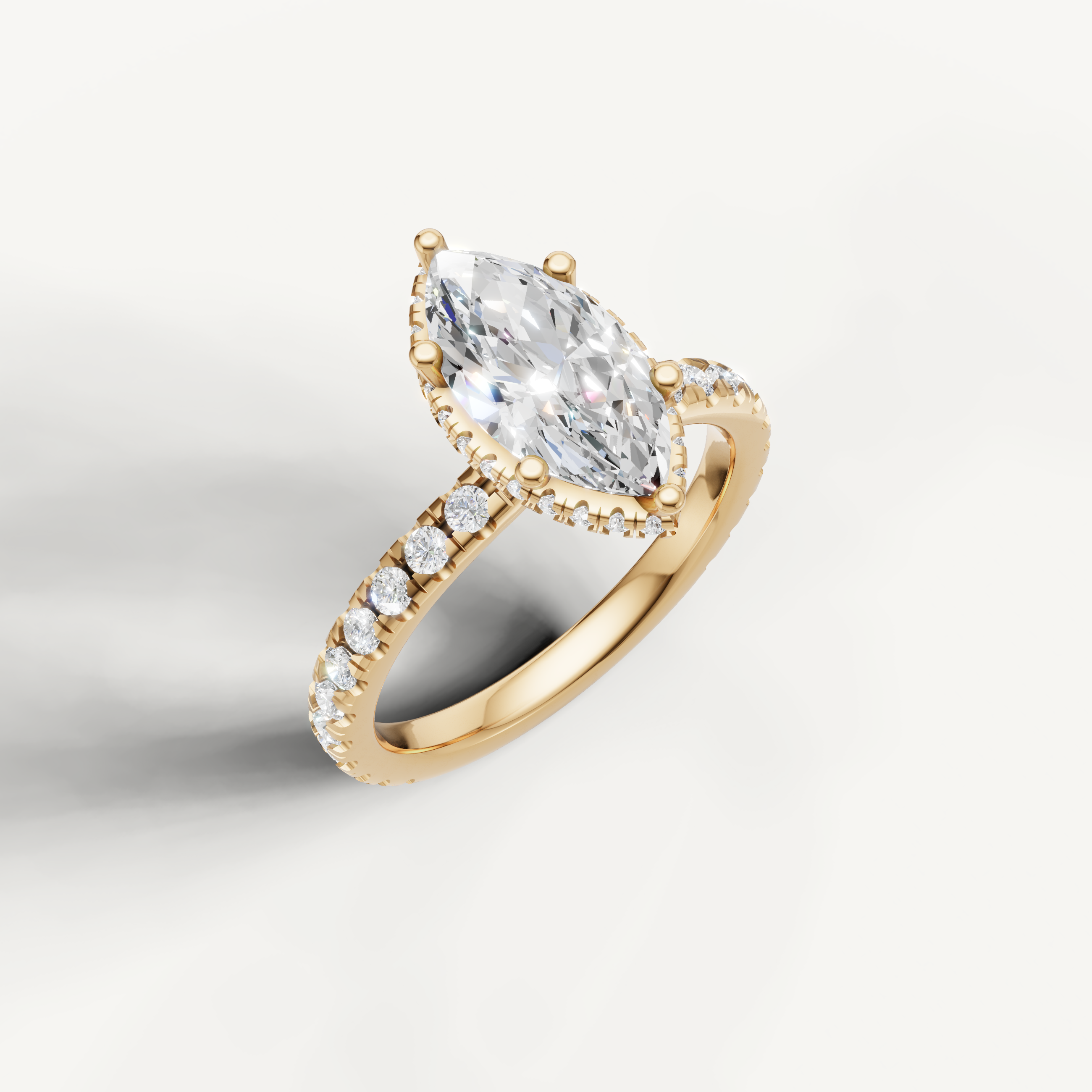 yellow gold marquise solitaire ring with pavé diamond shank