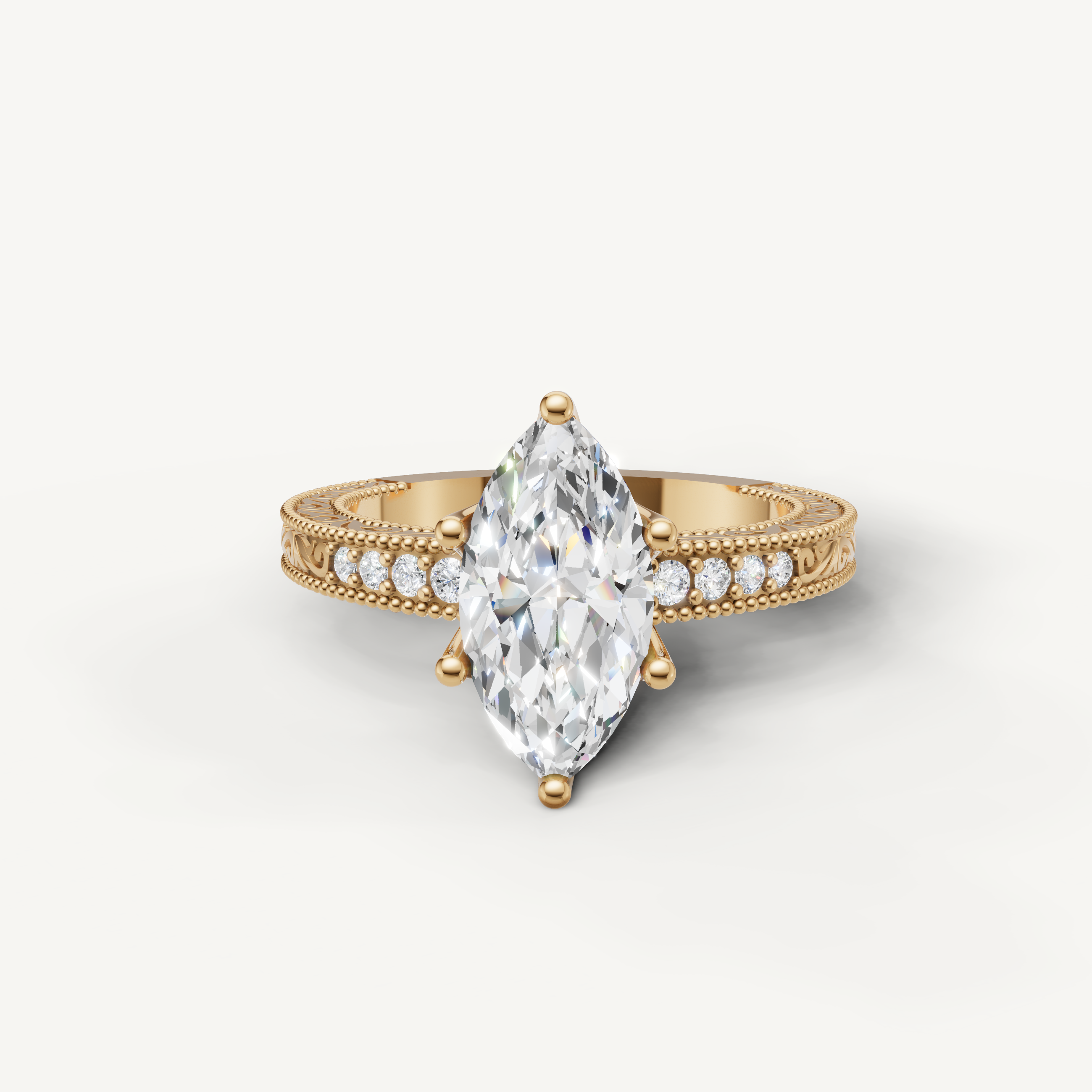 Vintage marquise cut lab grown diamond engagement ring in 14K yellow gold with intricate filigree and pavé detailing by Raul Diamonds.