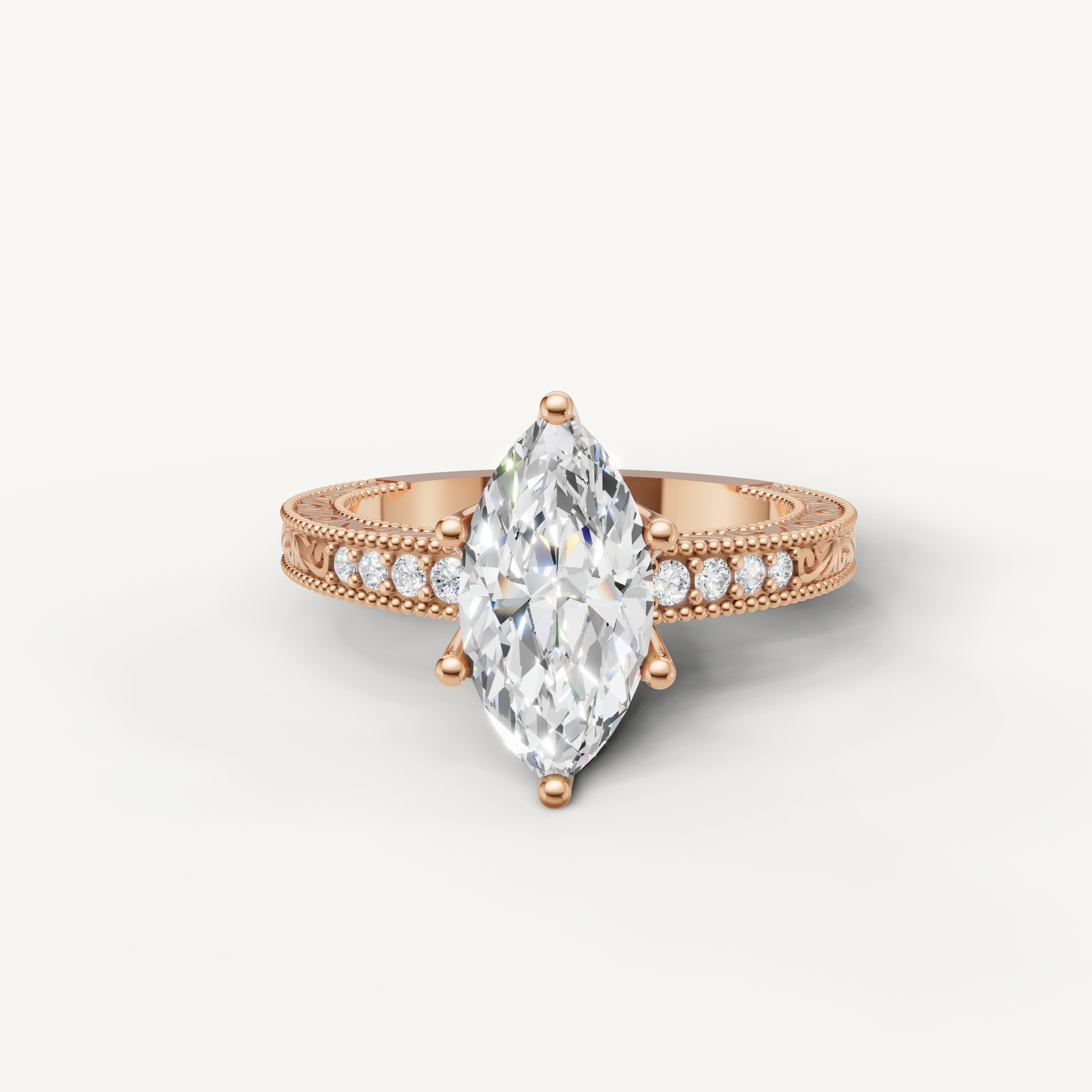 Vintage marquise cut lab grown diamond engagement ring in 14K rose gold with detailed milgrain and pavé accents by Raul Diamonds.