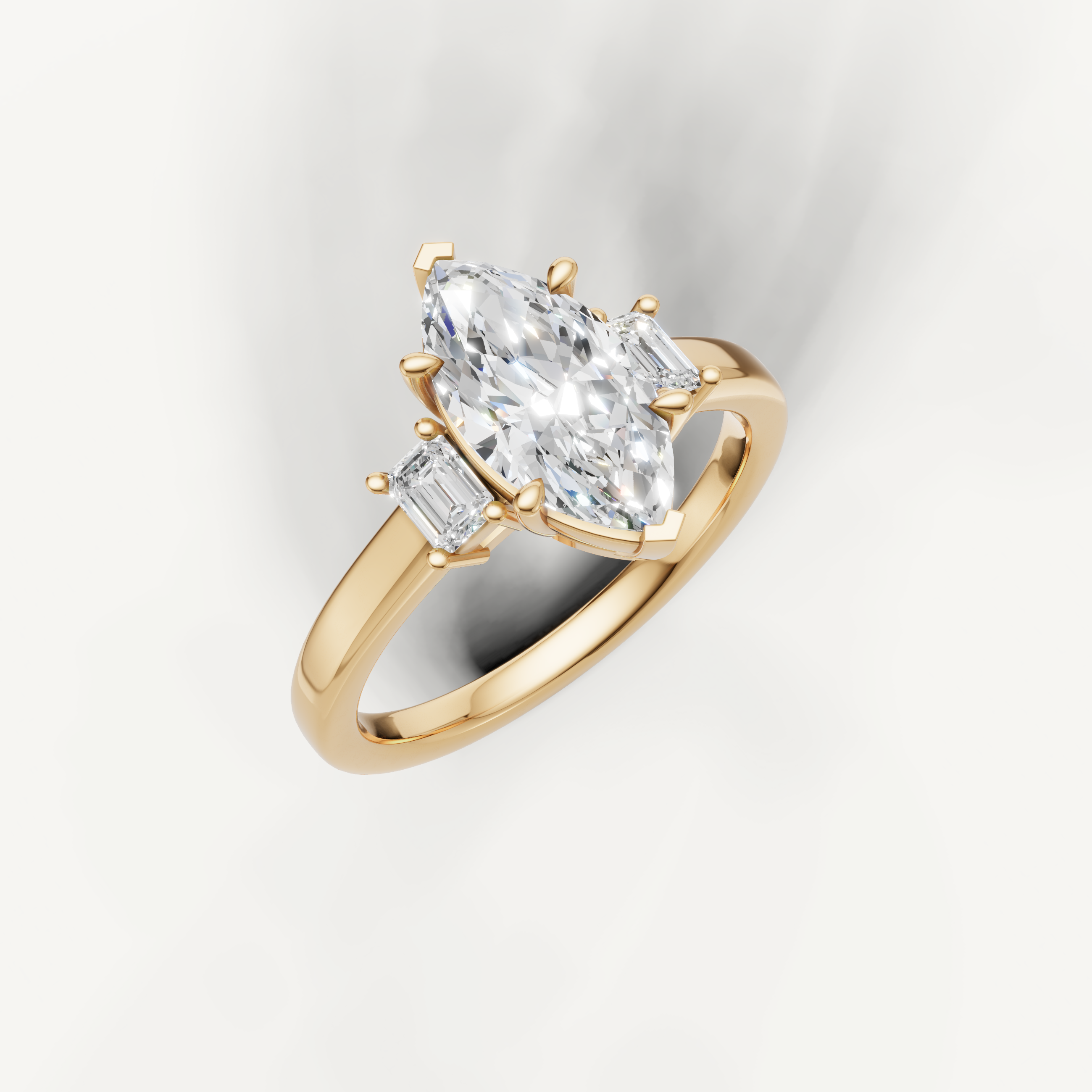 14K yellow gold marquise lab grown diamond ring with tapered baguette side diamonds and sleek band