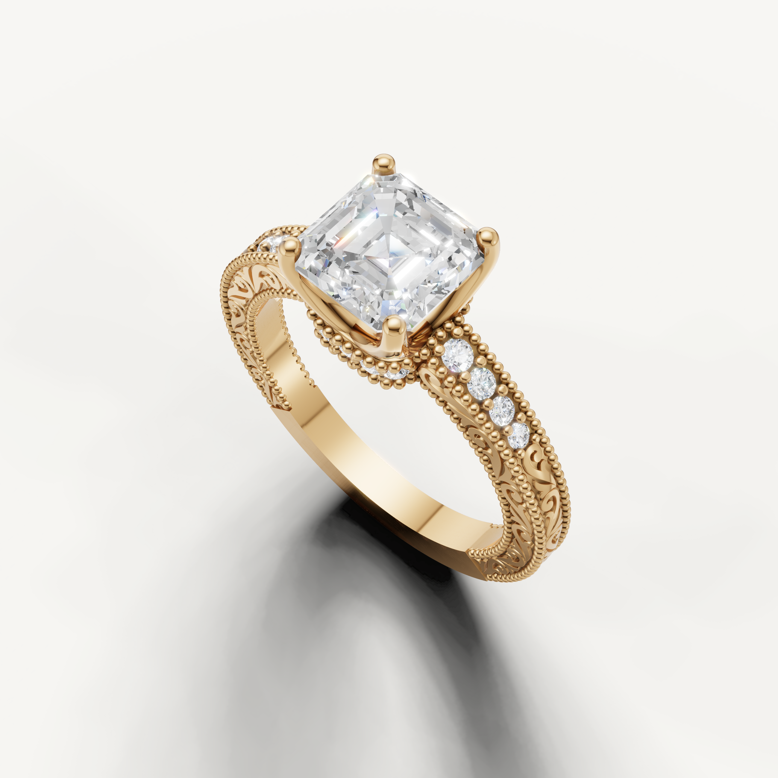 Elegant vintage-style Asscher diamond engagement ring with pavé accents and detailed yellow gold band from Raul Diamonds.
