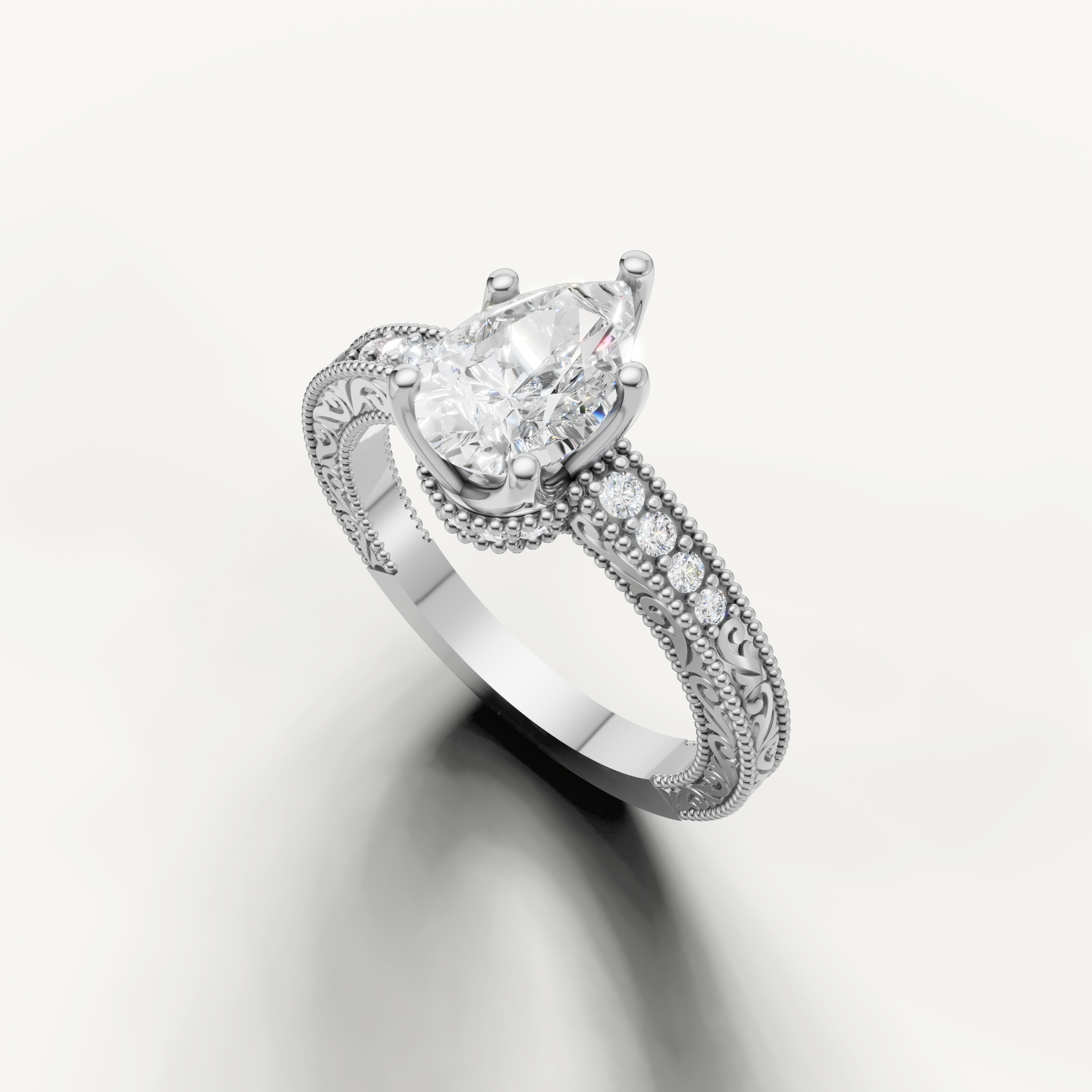 Elegant pear diamond engagement ring in white gold with vintage-inspired pavé detailing by Raul Diamonds.