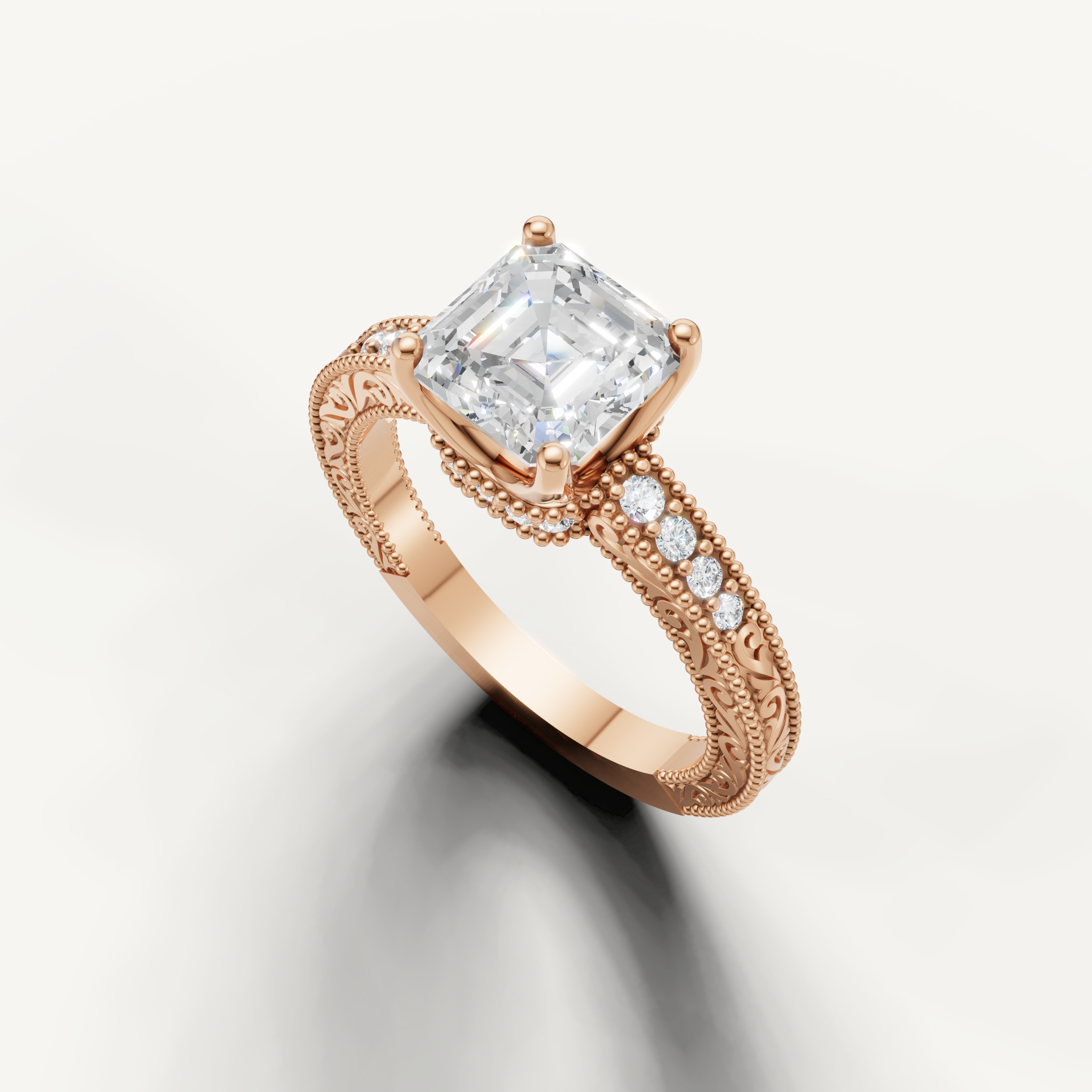Vintage-inspired Asscher diamond engagement ring with ornate scrollwork band in 14K rose gold from Raul Diamonds.