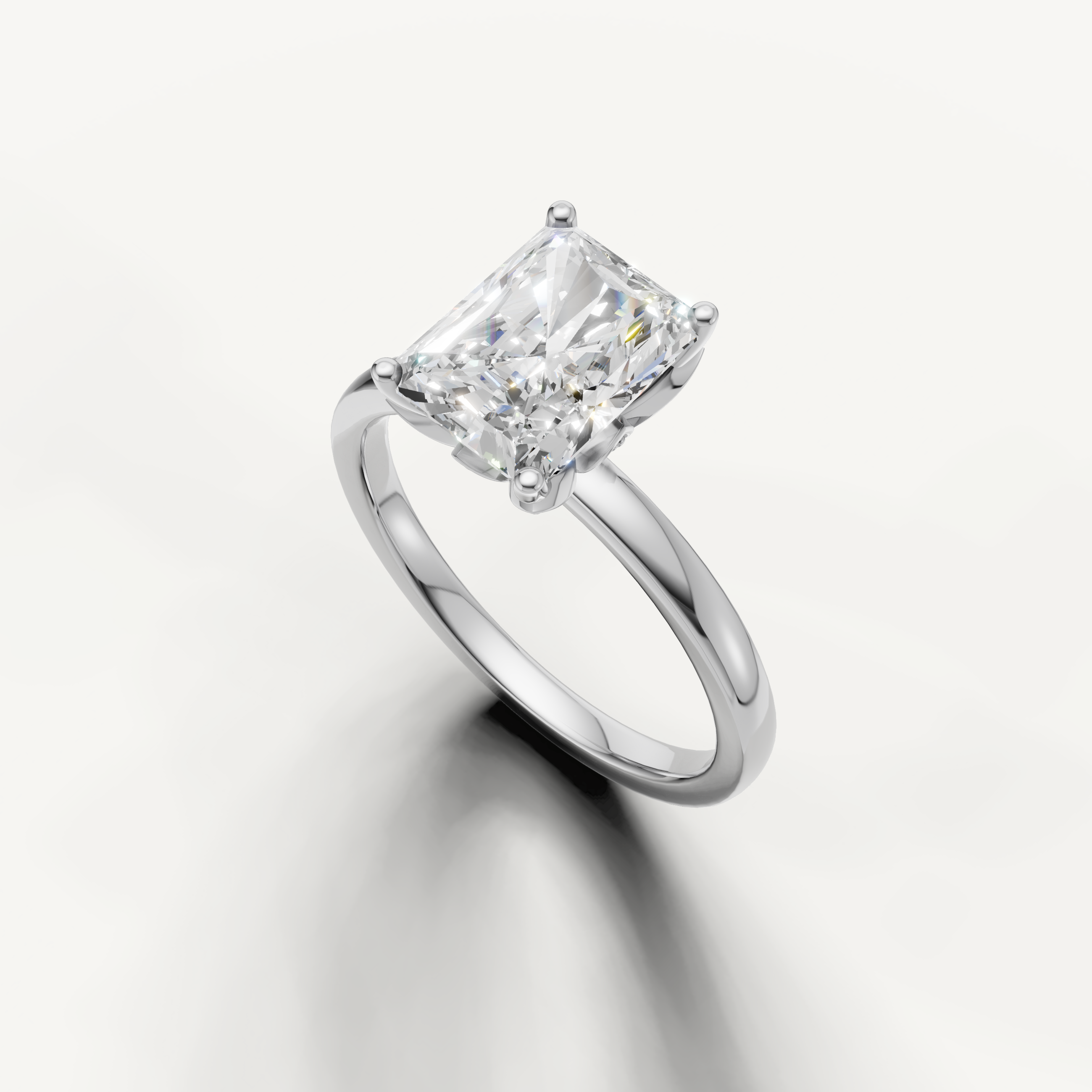 Elegant radiant cut solitaire ring with classic 4 prong setting white gold