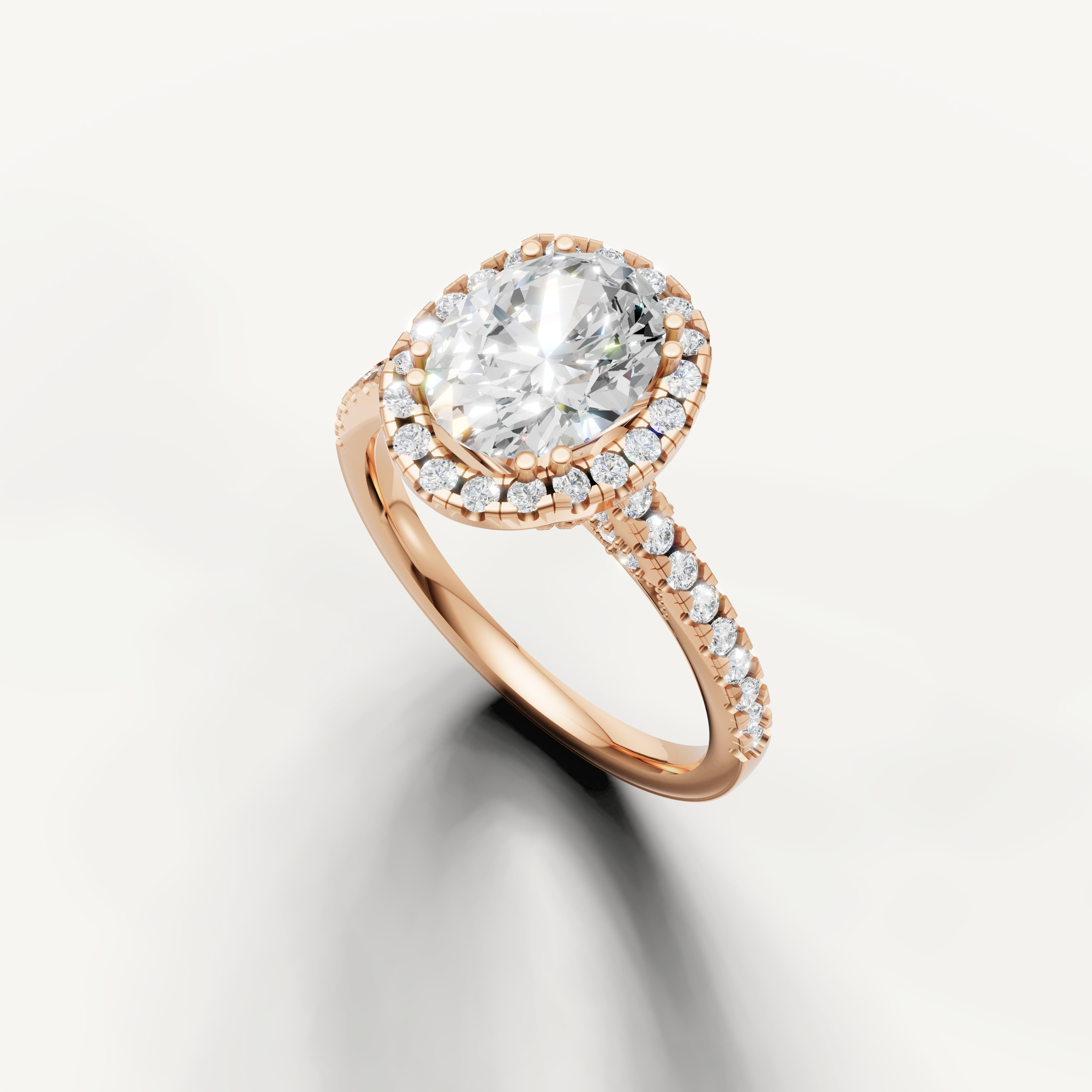 Rose gold oval cut lab grown diamond ring featuring a classic halo setting and delicate pavé band