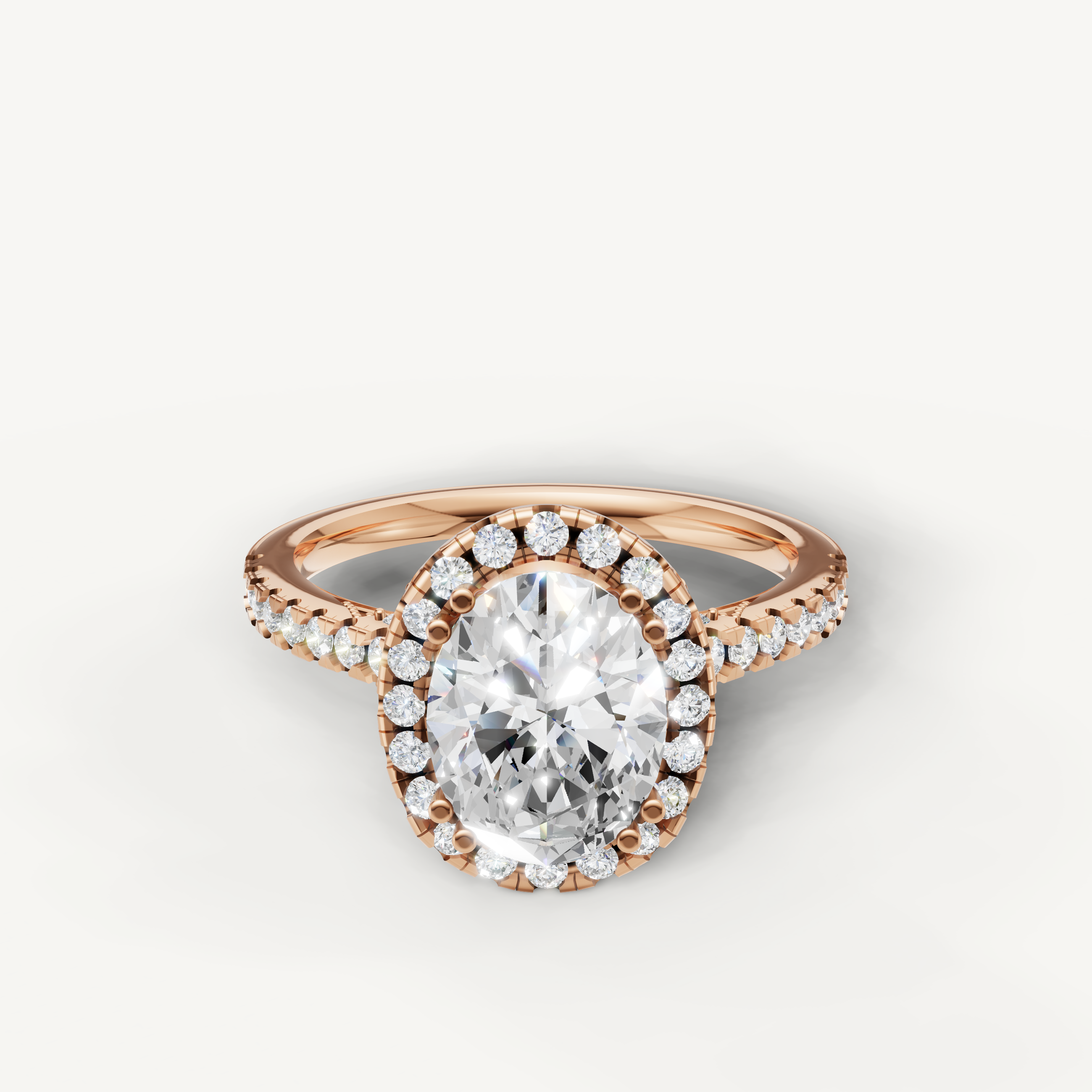 Oval cut lab grown diamond halo engagement ring in 14K rose gold with pavé diamond band by Raul Diamonds