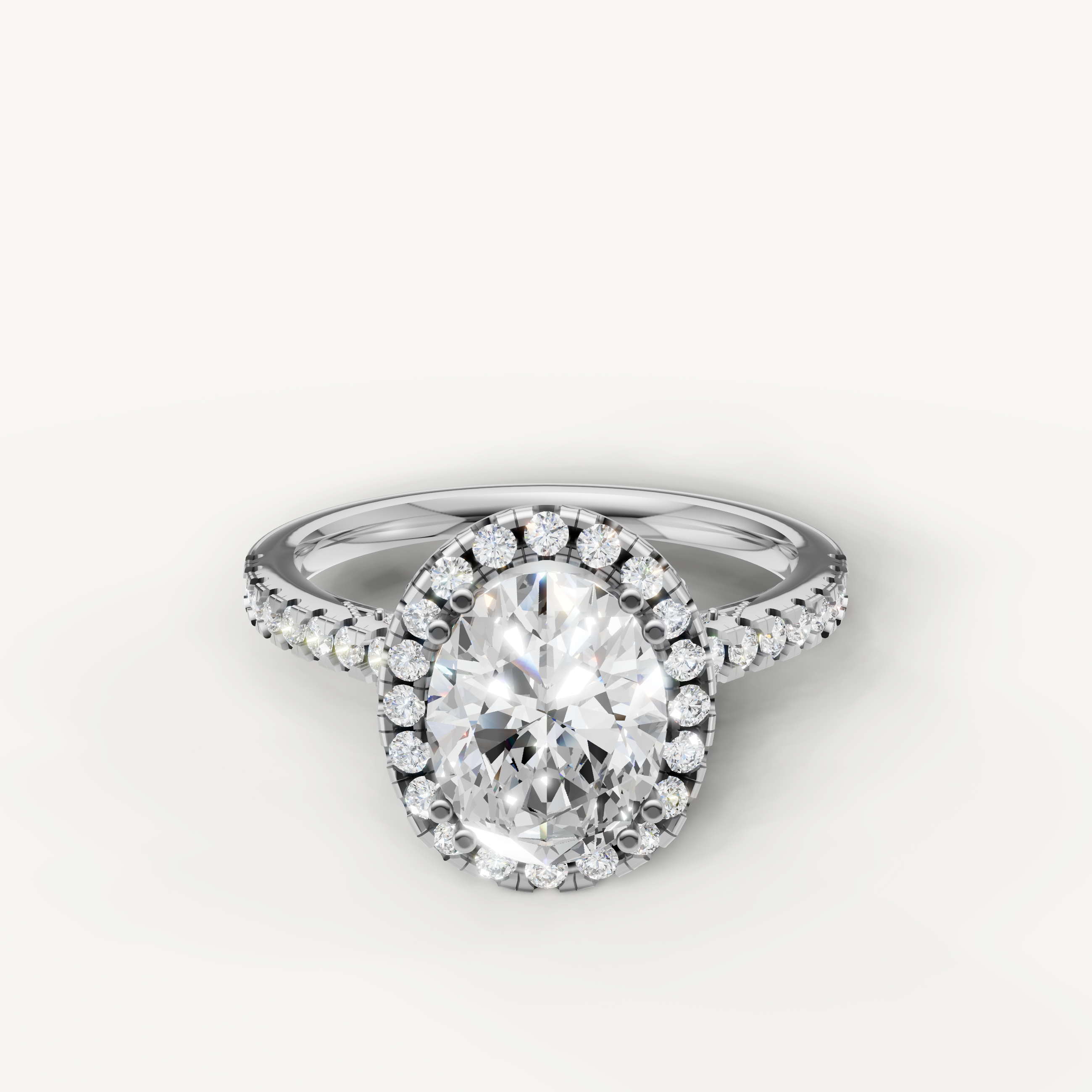 Oval cut lab grown diamond halo engagement ring in 14K white gold with pavé diamond band by Raul Diamonds
